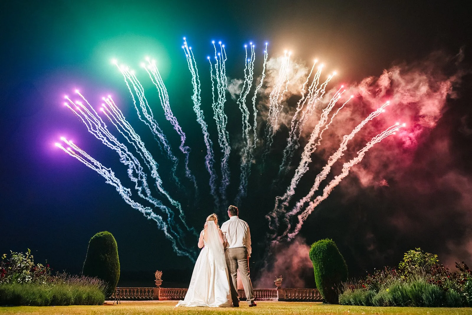 Prestwold Hall Wedding Venue Guide - bride and groom watching on during the fireworks display