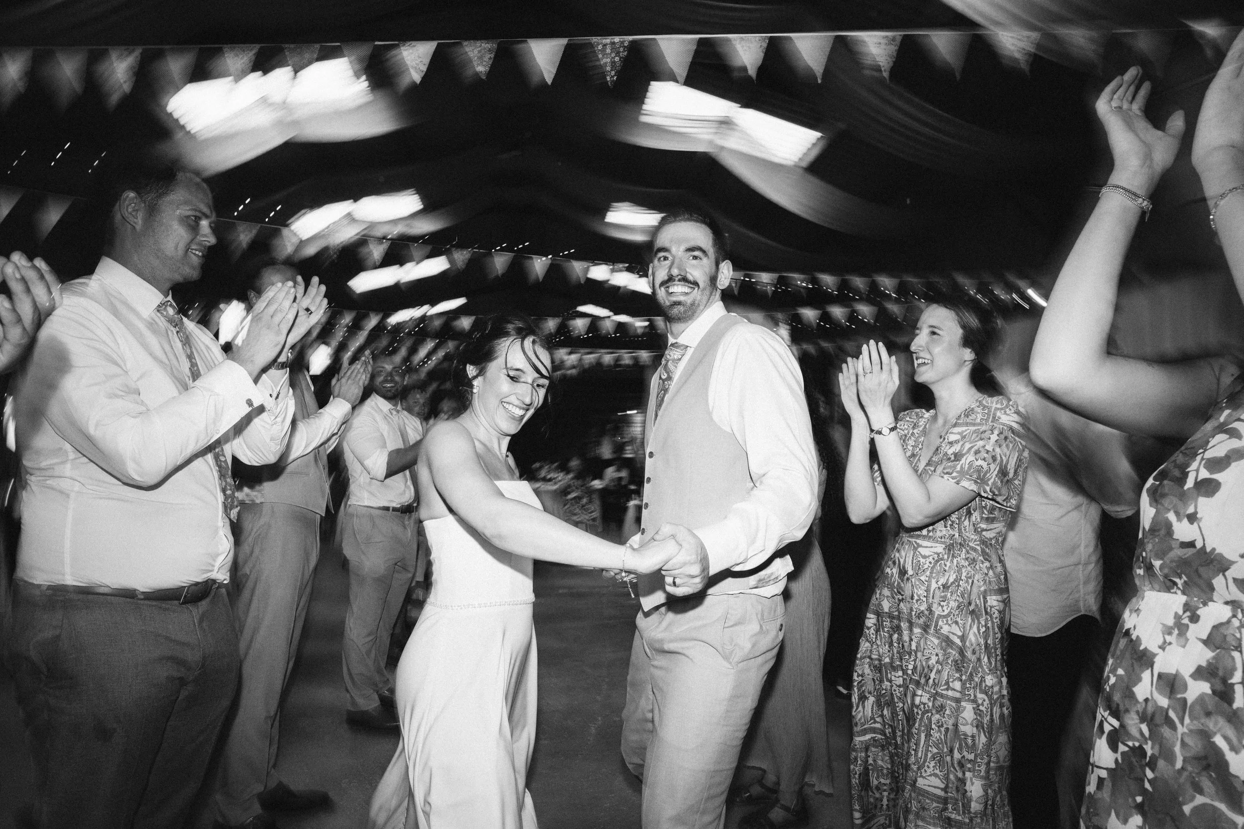 THE TRACTOR BARN WEDDING PHOTOGRAPHER - bride and groom dancing during their ceilidh at the Tractor Barn