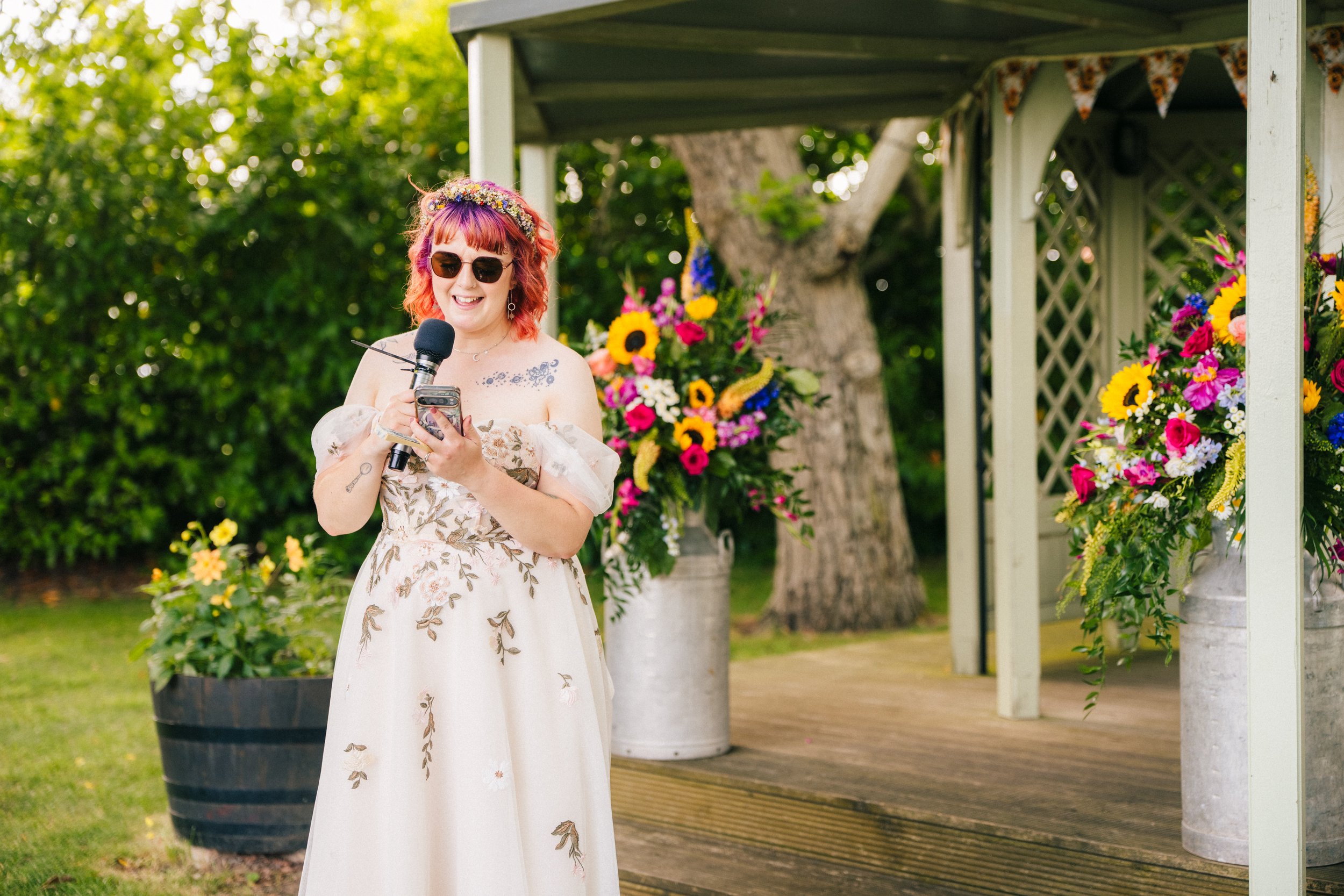 PHEASANTRY BREWERY WEDDING PHOTOGRAPHY - bride doing her wedding speech outside at the Pheasantry Brewery