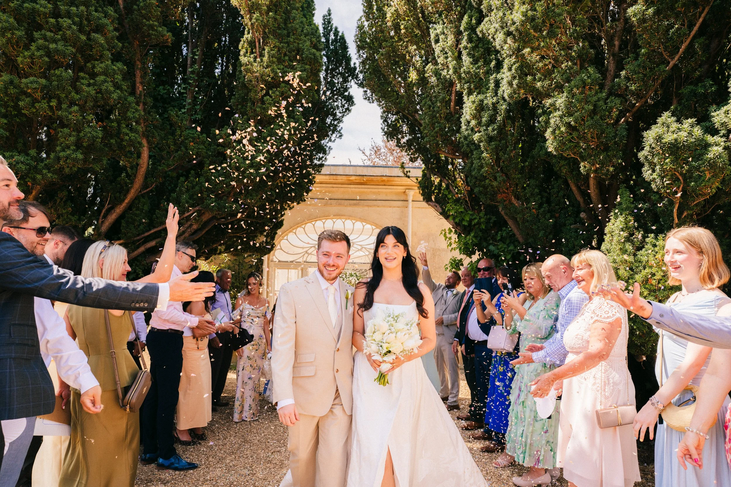 BARTON HALL WEDDING PHOTOGRAPHY - bride and groom getting covered in confetti