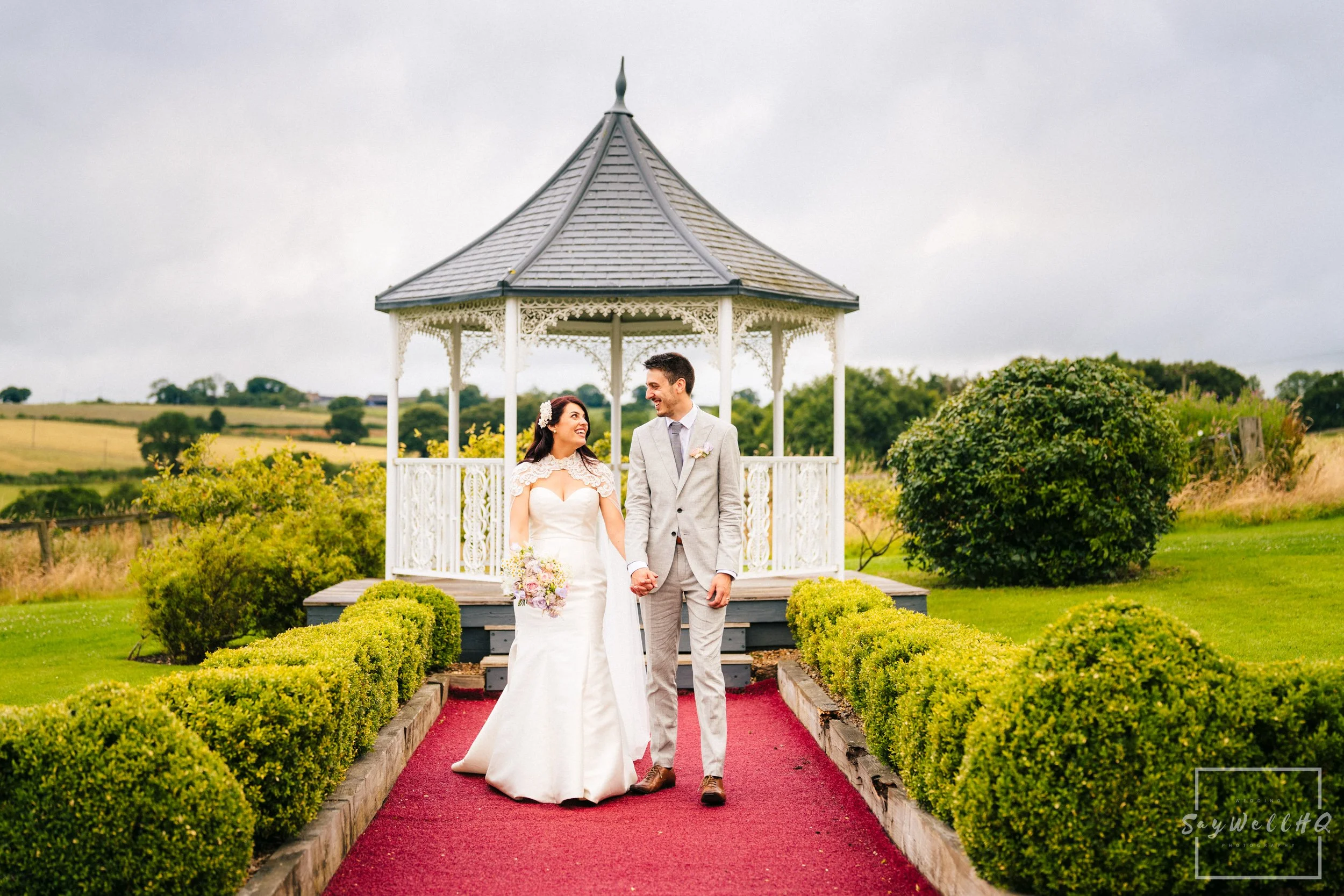Shottle Hall Wedding Photographer | bride and groom walking along a path at Shottle Hall