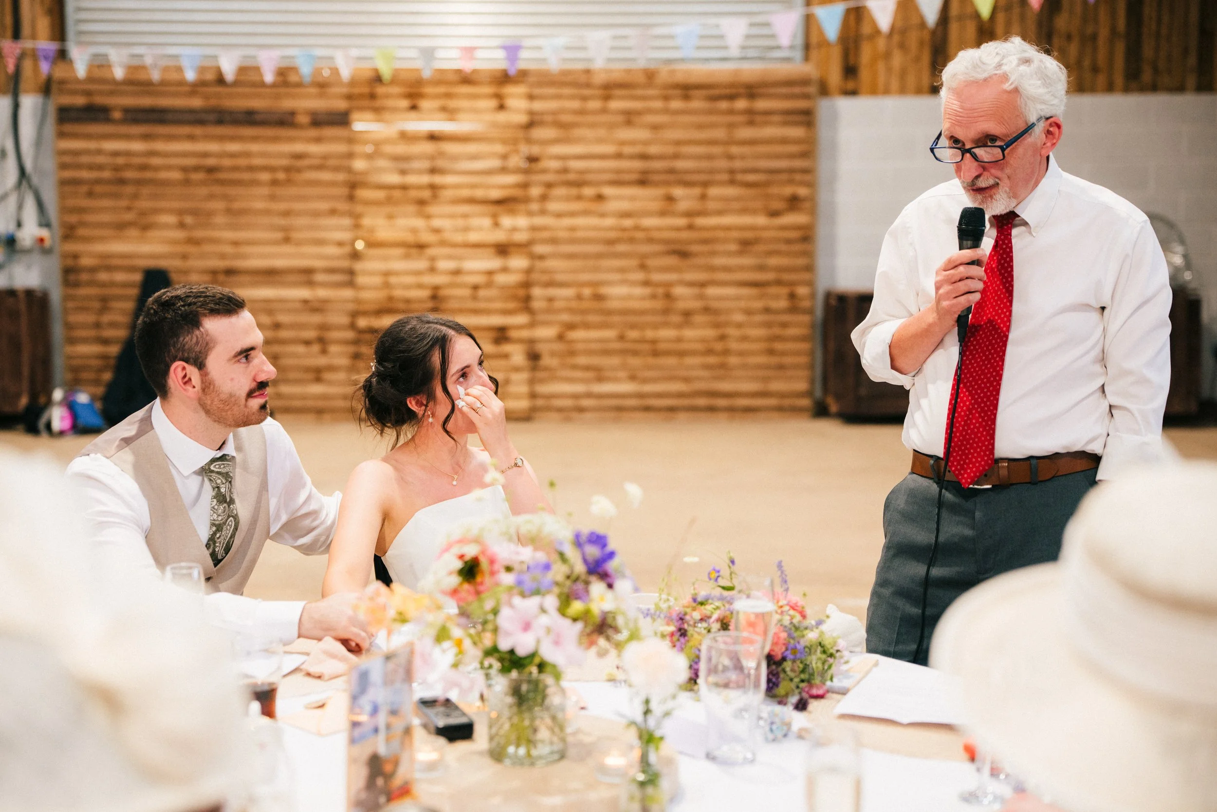 THE TRACTOR BARN WEDDING PHOTOGRAPHRER - bride getting emotional during her Dad's wedding speech