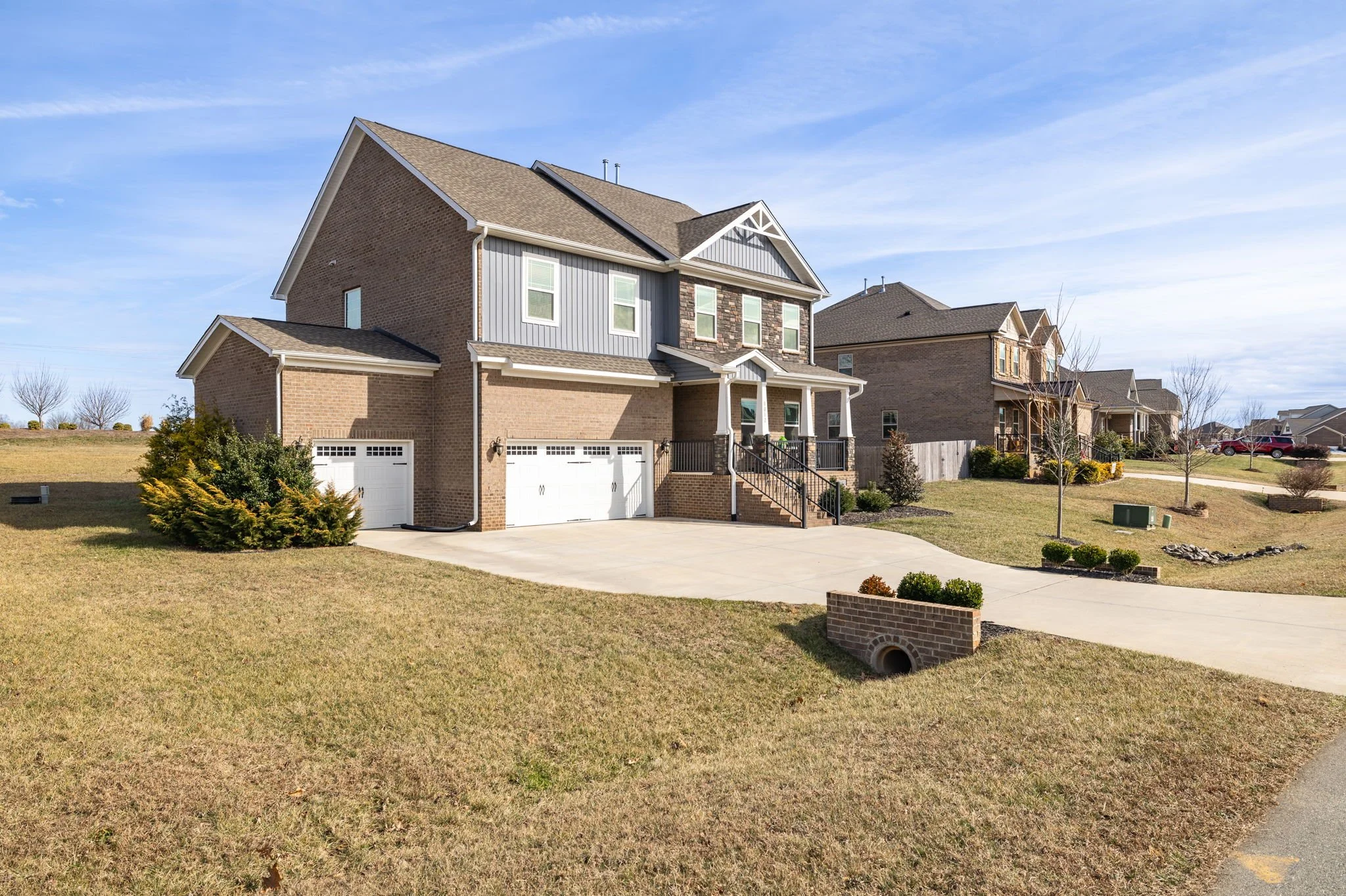 Street view of 8012 NW Meadows Drive, Stokesdale, NC 27357 in an established neighborhood. Listed by Delia Knight, REALTOR® with Howard Hanna Allen Tate Real Estate.