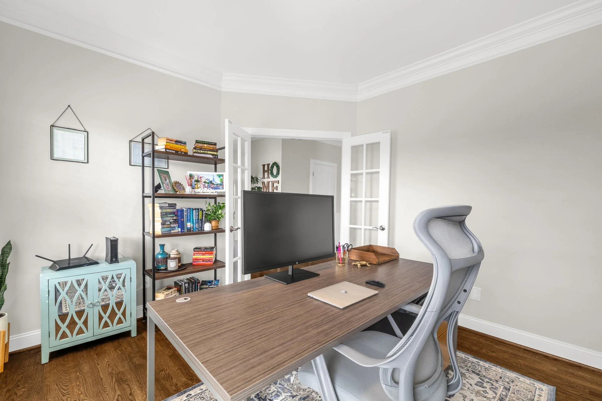 Office with French doors and hardwood floors at 8012 NW Meadows Drive, Stokesdale, NC 27357. Listed by Delia Knight, REALTOR® with Howard Hanna Allen Tate Real Estate.