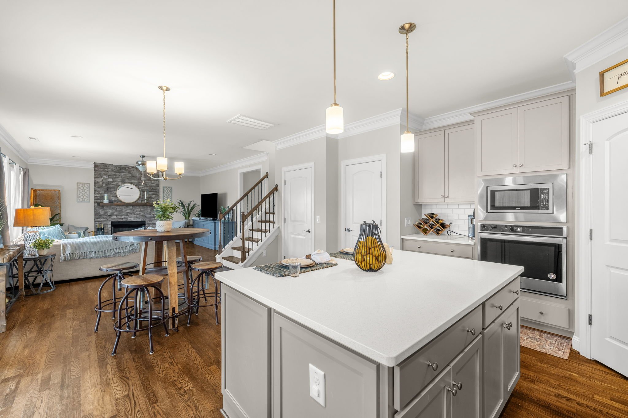 Kitchen with wall oven, microwave, and pantry at 8012 NW Meadows Drive, Stokesdale, NC 27357. Listed by Delia Knight, REALTOR® with Howard Hanna Allen Tate Real Estate.