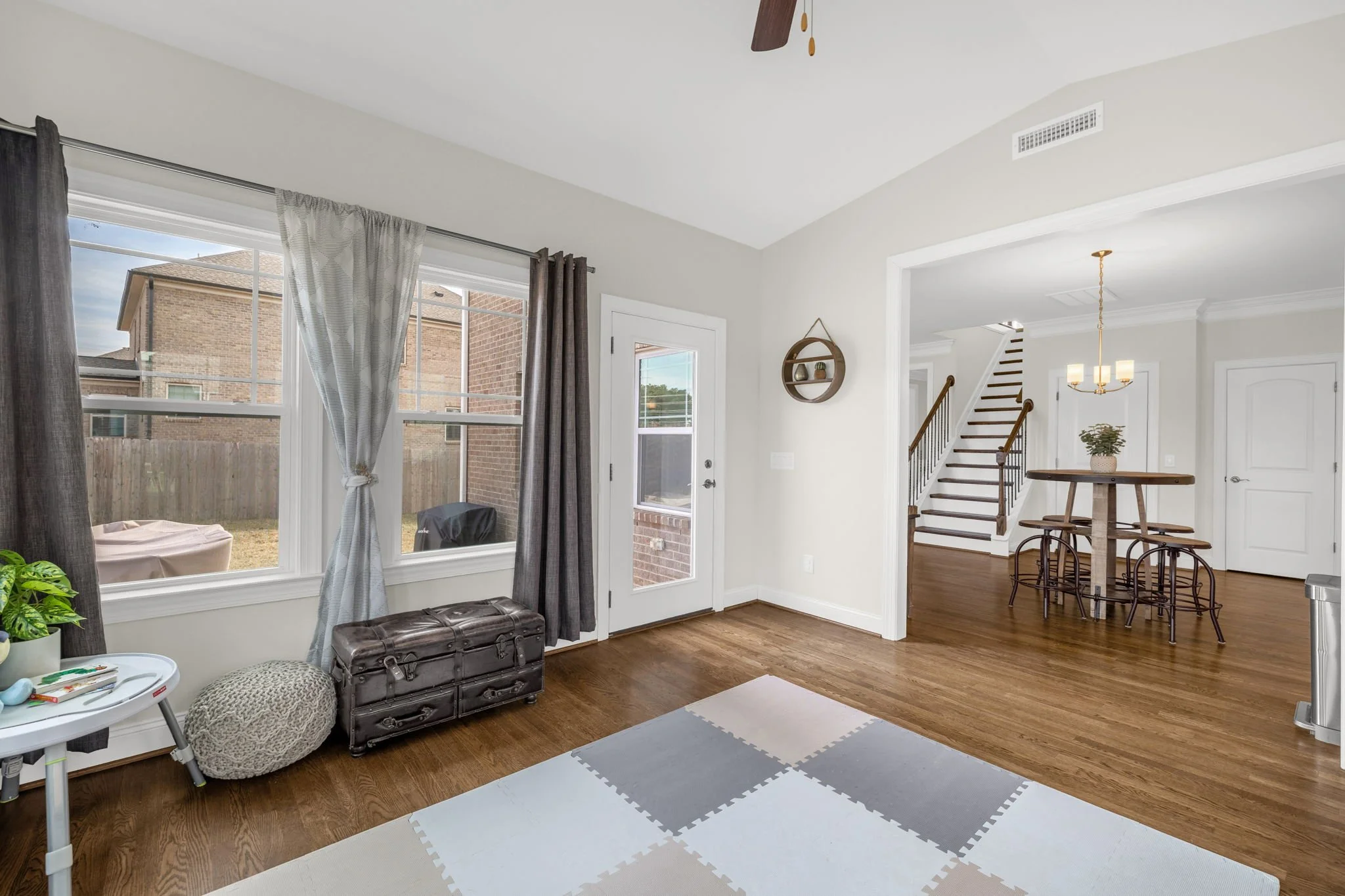 Sun room with door to patio and open to kitchen at 8012 NW Meadows Drive, Stokesdale, NC 27357. Listed by Delia Knight, REALTOR® with Howard Hanna Allen Tate Real Estate.