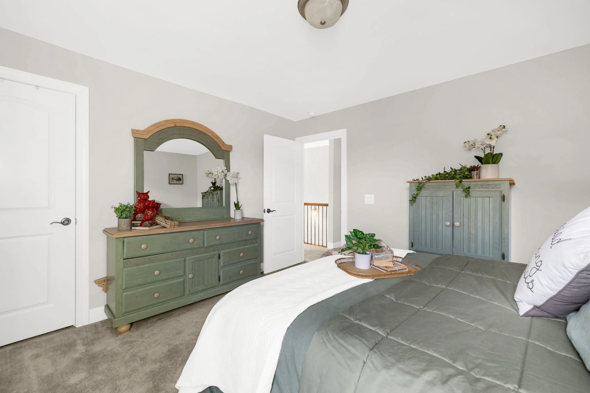 Bedroom three with closet and hallway access at 8012 NW Meadows Drive, Stokesdale, NC 27357. Listed by Delia Knight, REALTOR® with Howard Hanna Allen Tate Real Estate.