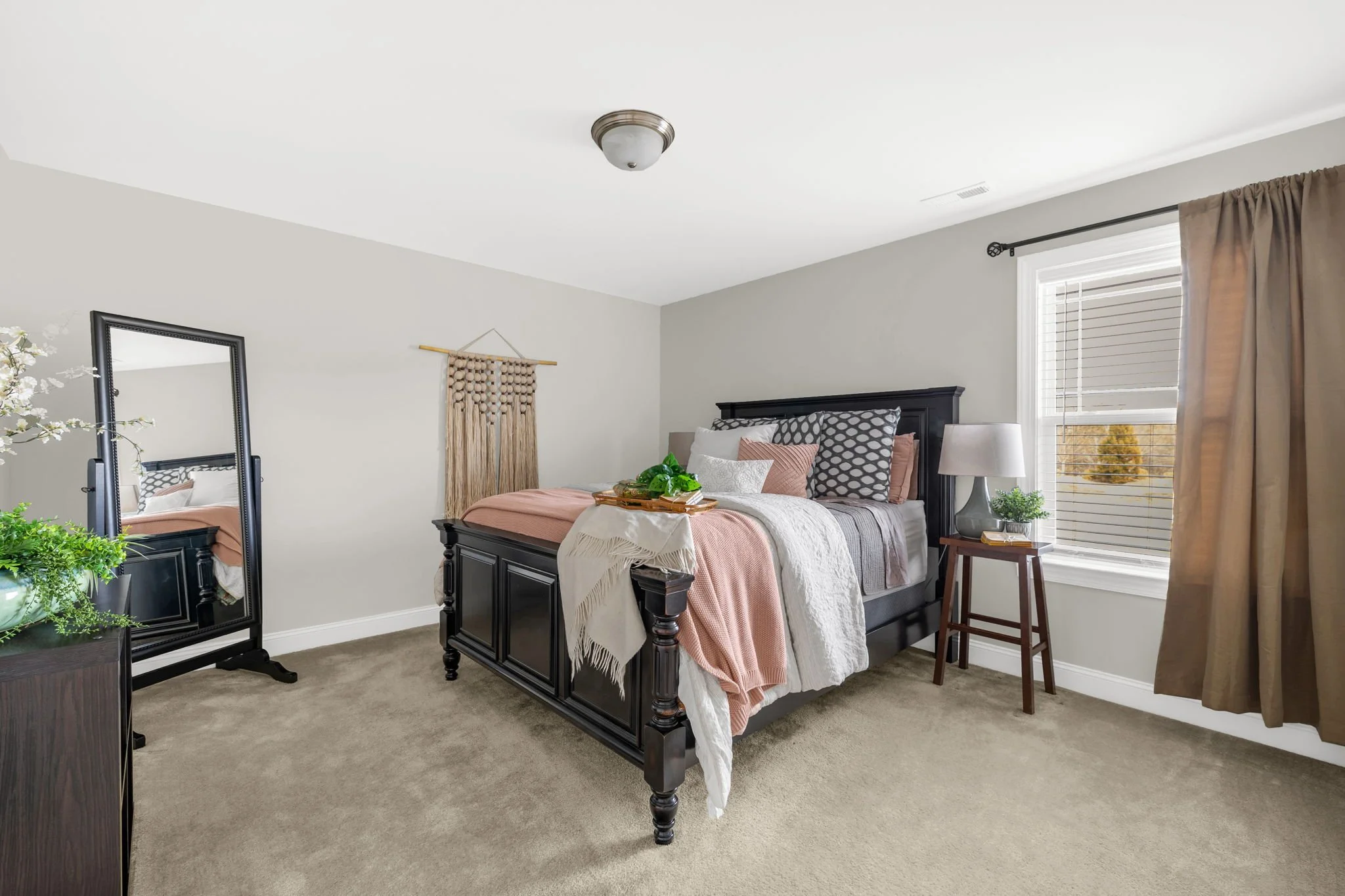 Spacious bedroom four with natural light at 8012 NW Meadows Drive, Stokesdale, NC 27357. Listed by Delia Knight, REALTOR® with Howard Hanna Allen Tate Real Estate.