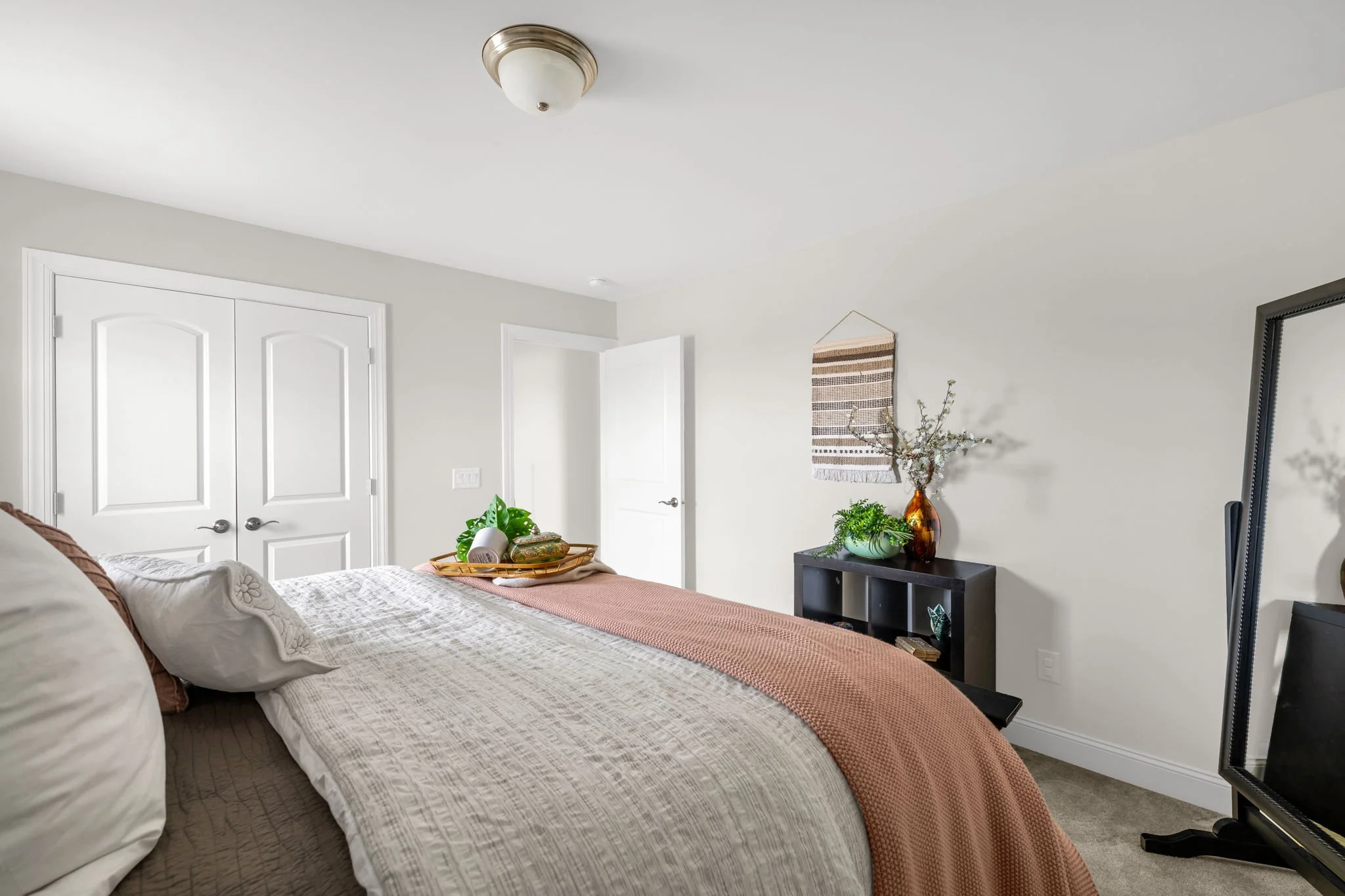 Bedroom four with double closet doors at 8012 NW Meadows Drive, Stokesdale, NC 27357. Listed by Delia Knight, REALTOR® with Howard Hanna Allen Tate Real Estate.
