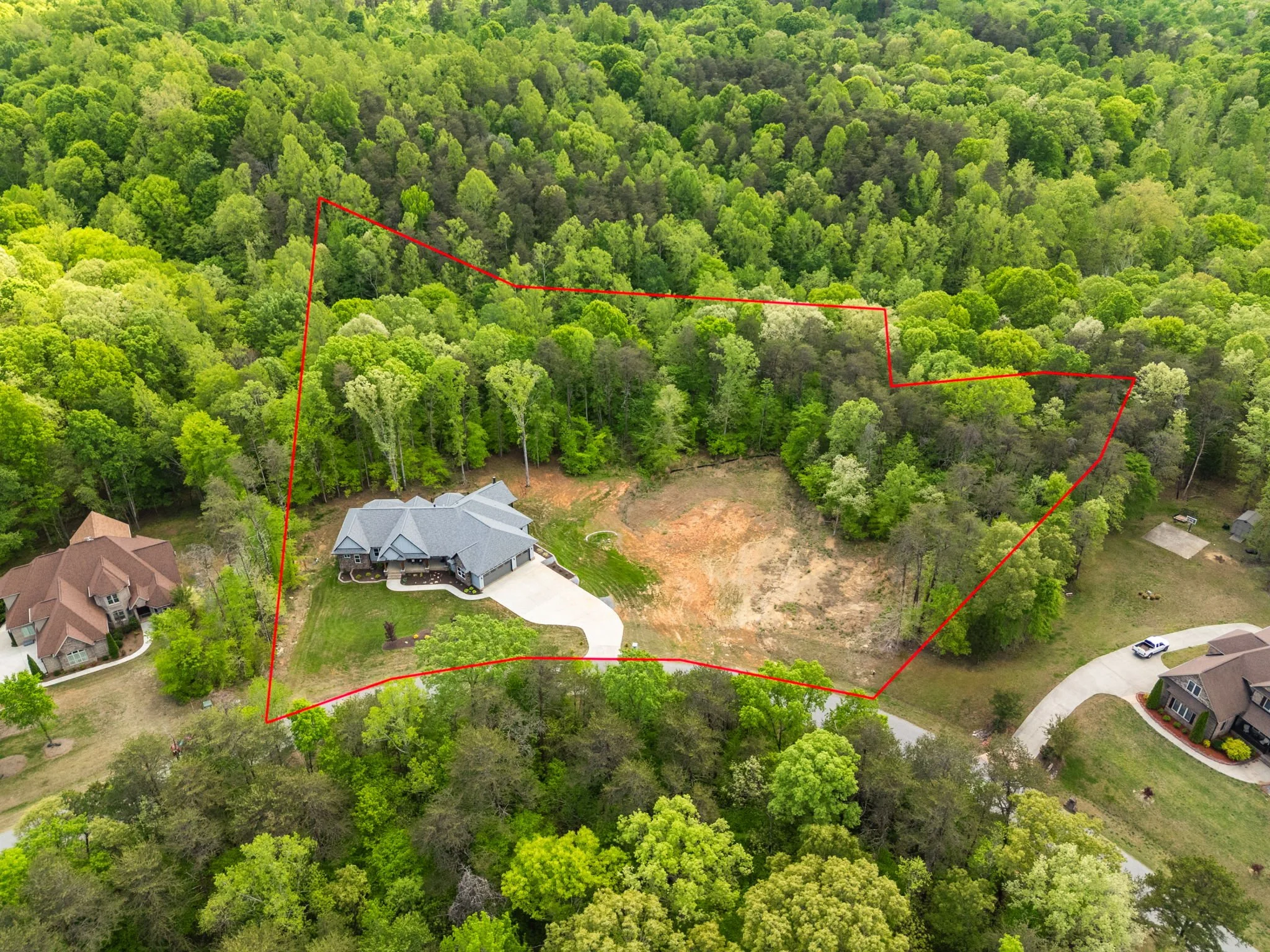 69-delia-knight-7351-hidden-view-dr-aerial-home-overview-oak-ridge-nc-27310.jpg