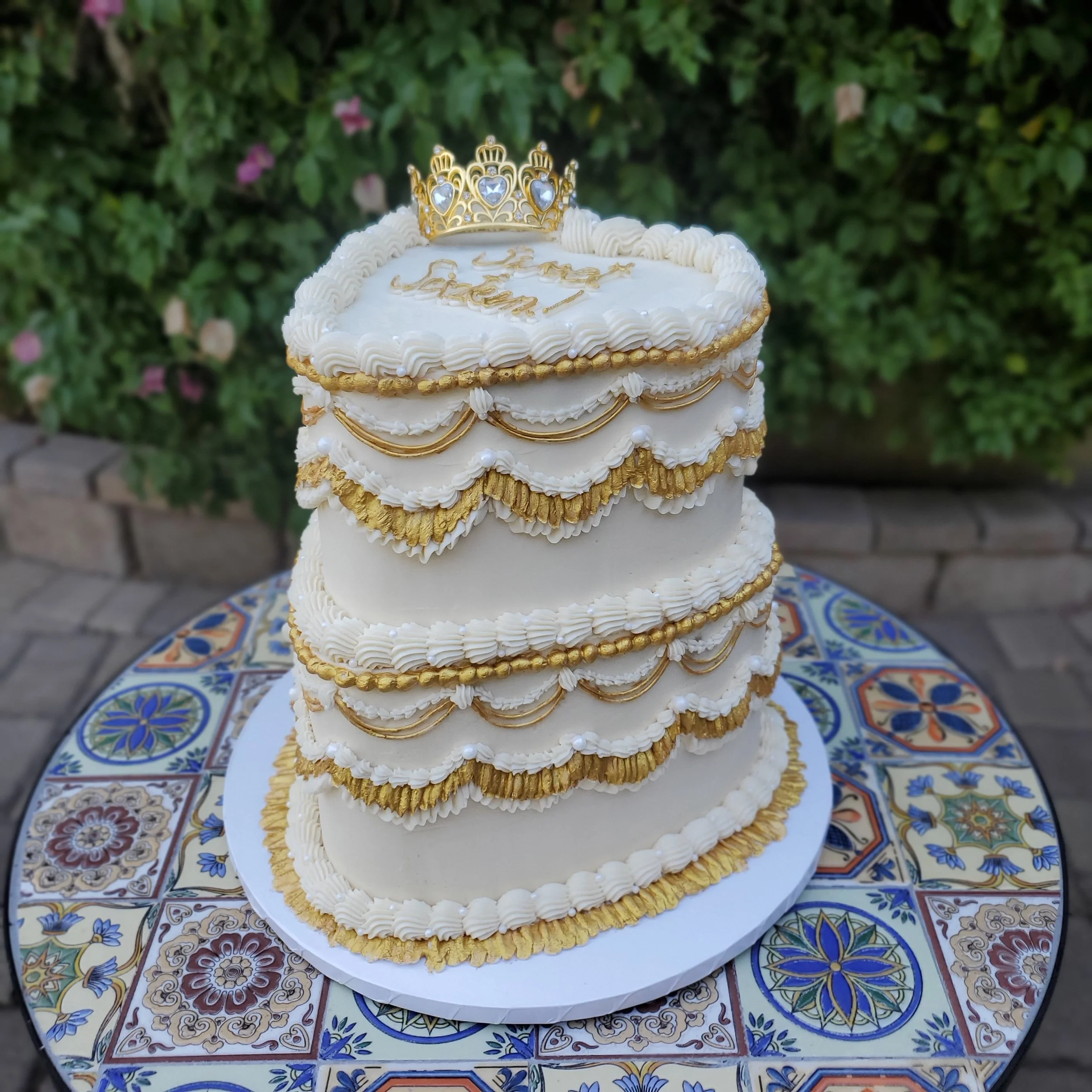 white and gold sweet 16 tiered vintage heart cake