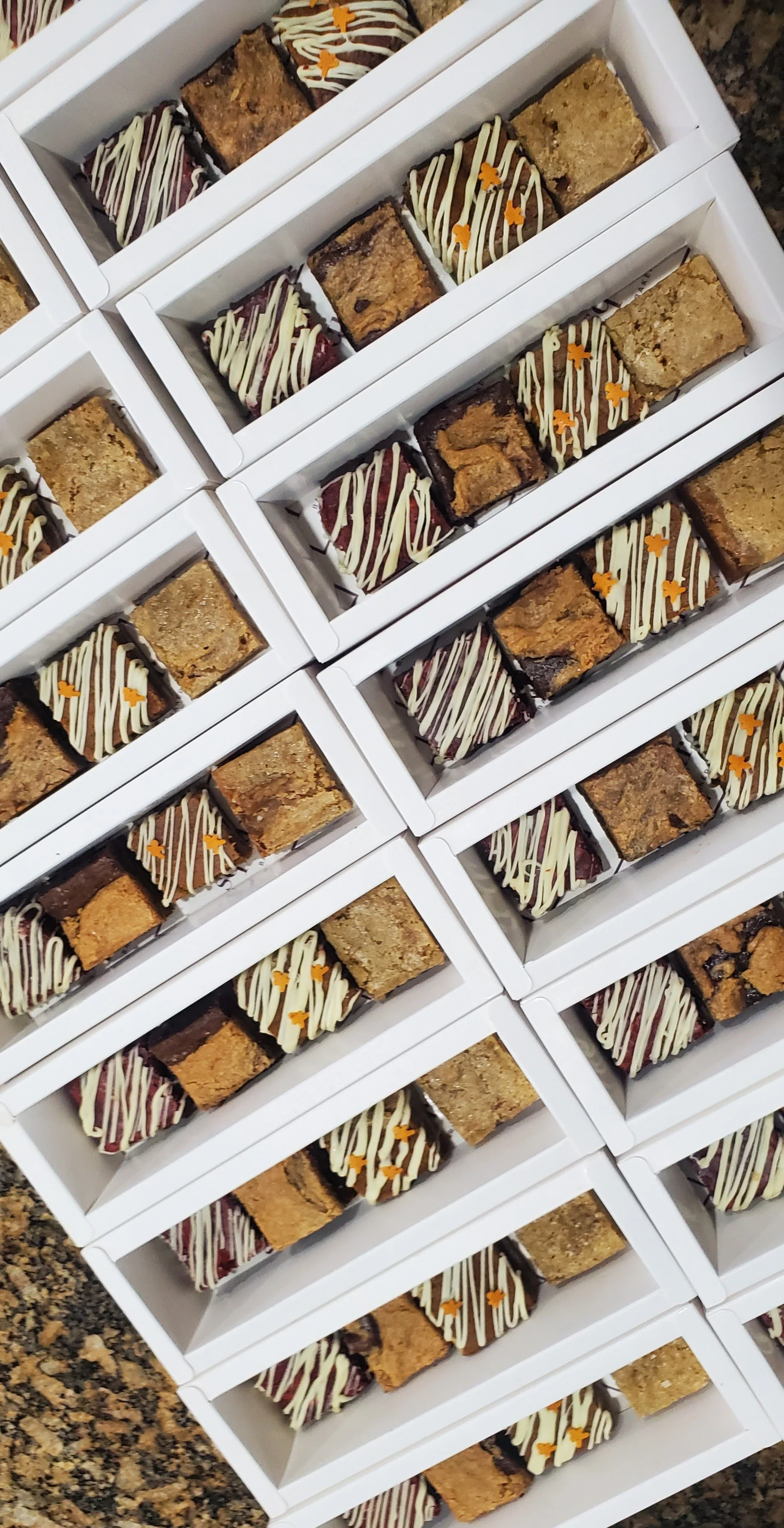 a collection of brownie bite boxes