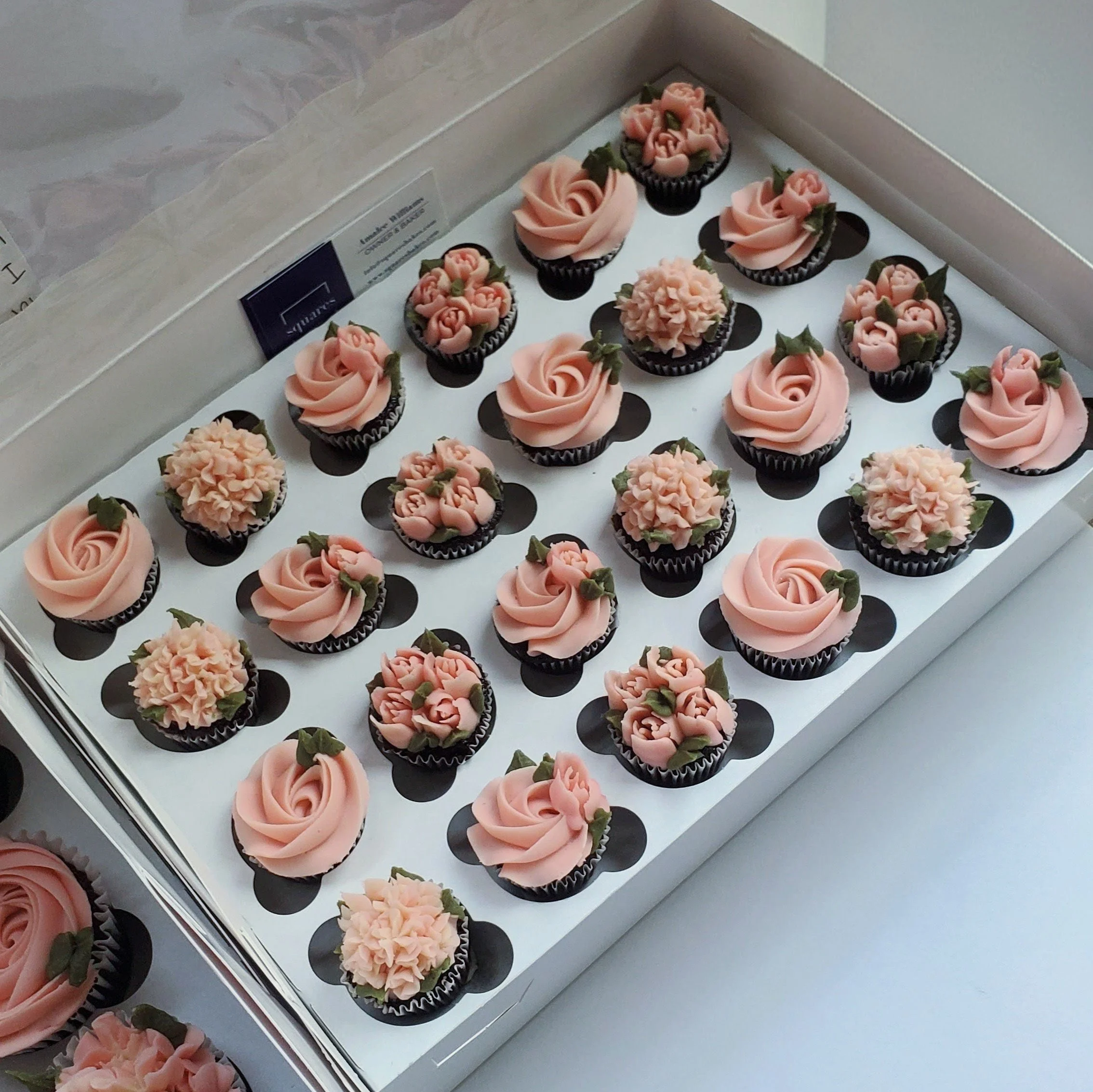 mini buttercream cupcakes with bush pink flowers