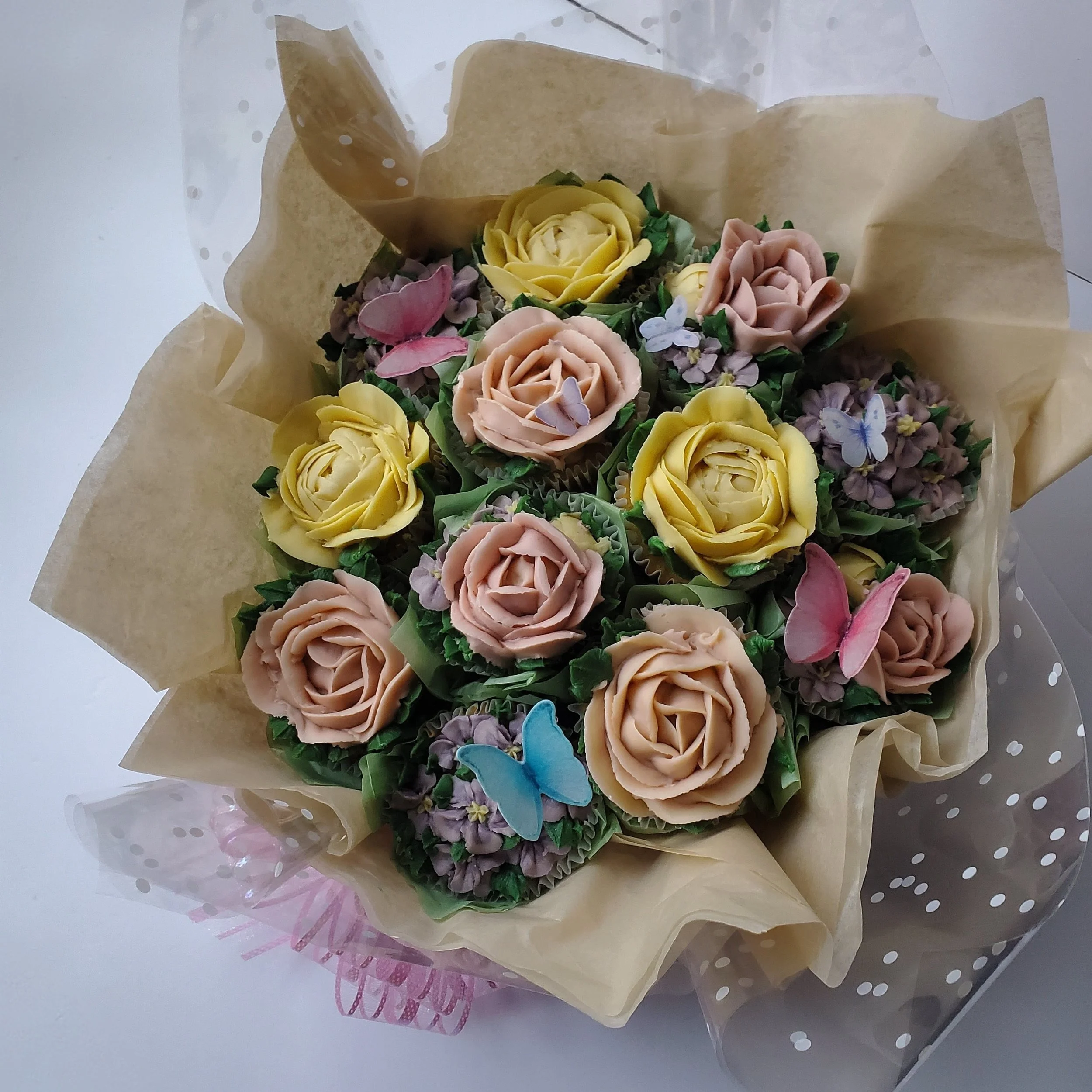 pastel floral cupcakes with roses and peonies