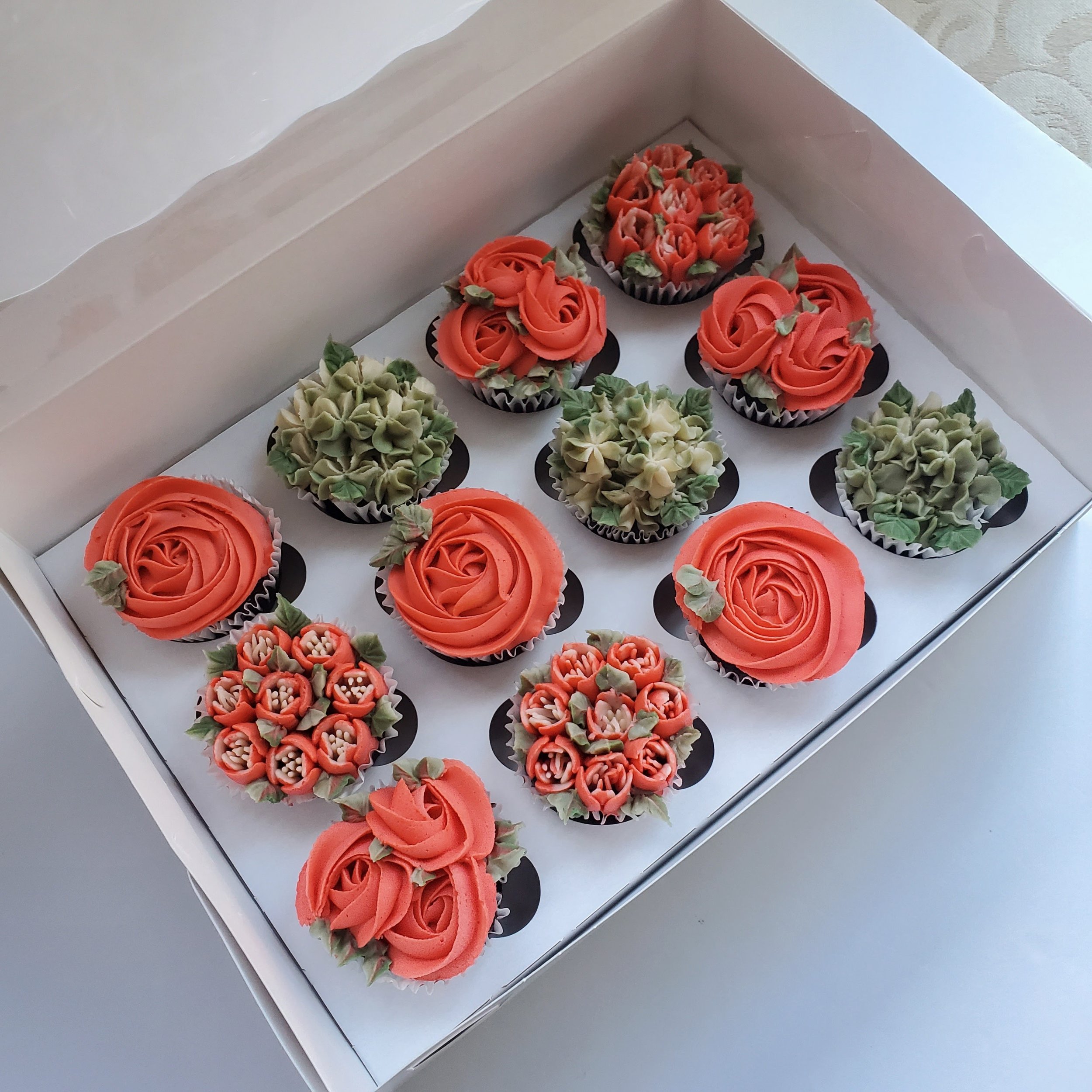 coral and green buttercream floral cupcakes