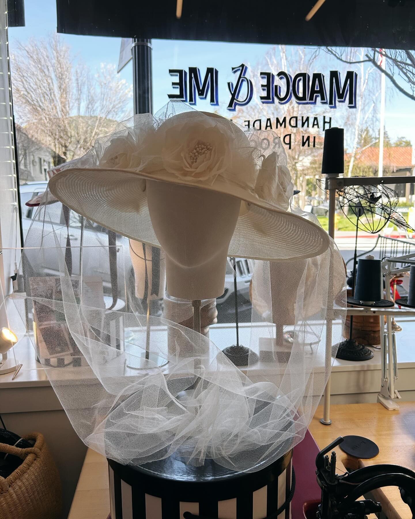 The Bianca wedding hat. Handmade silk roses mounted on a removable,  Petersham covered wire garland. The  silk tulle veil draped over the flowers and tucked into the garland is also removable. These lightly tacked to the hat features mean the hat can