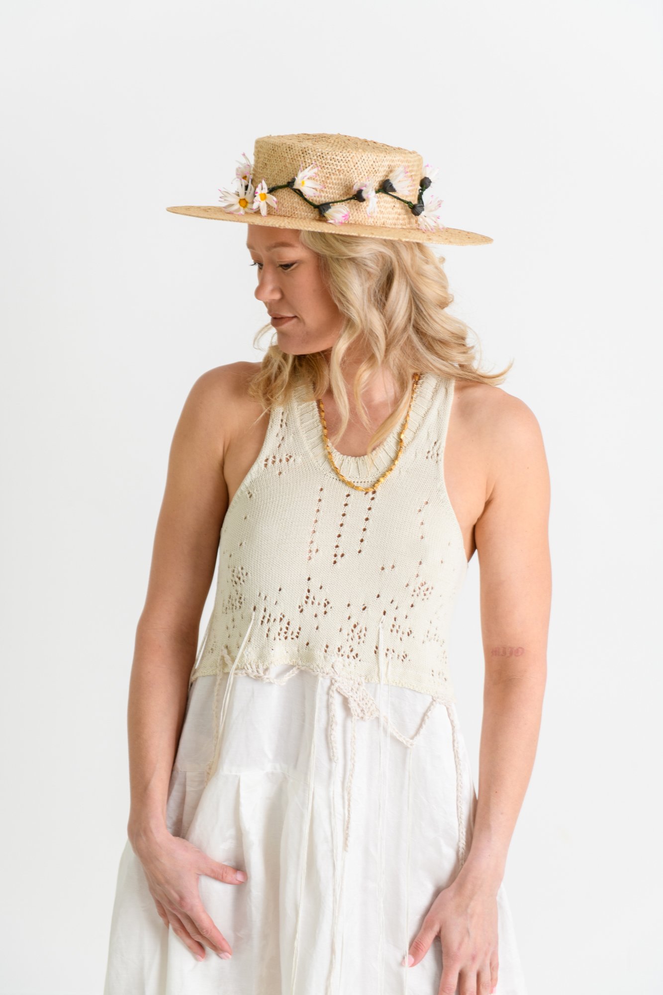 model-wearing-straw-floral-custom-made-hat.jpg