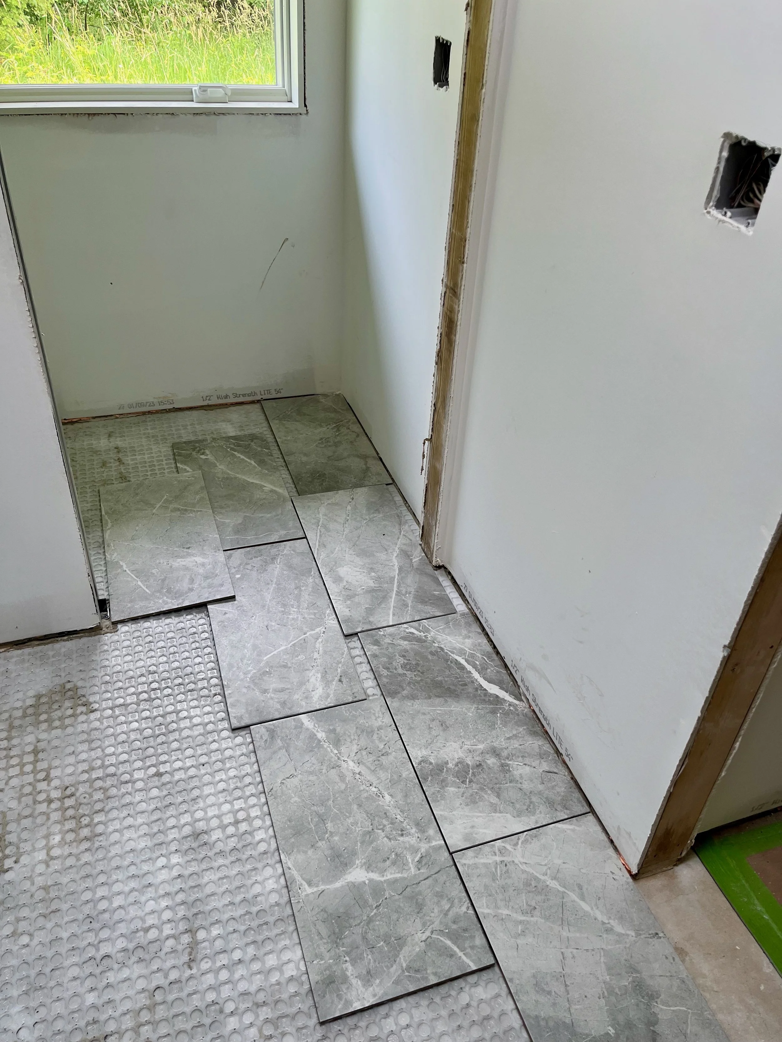 Tile floor being installed.