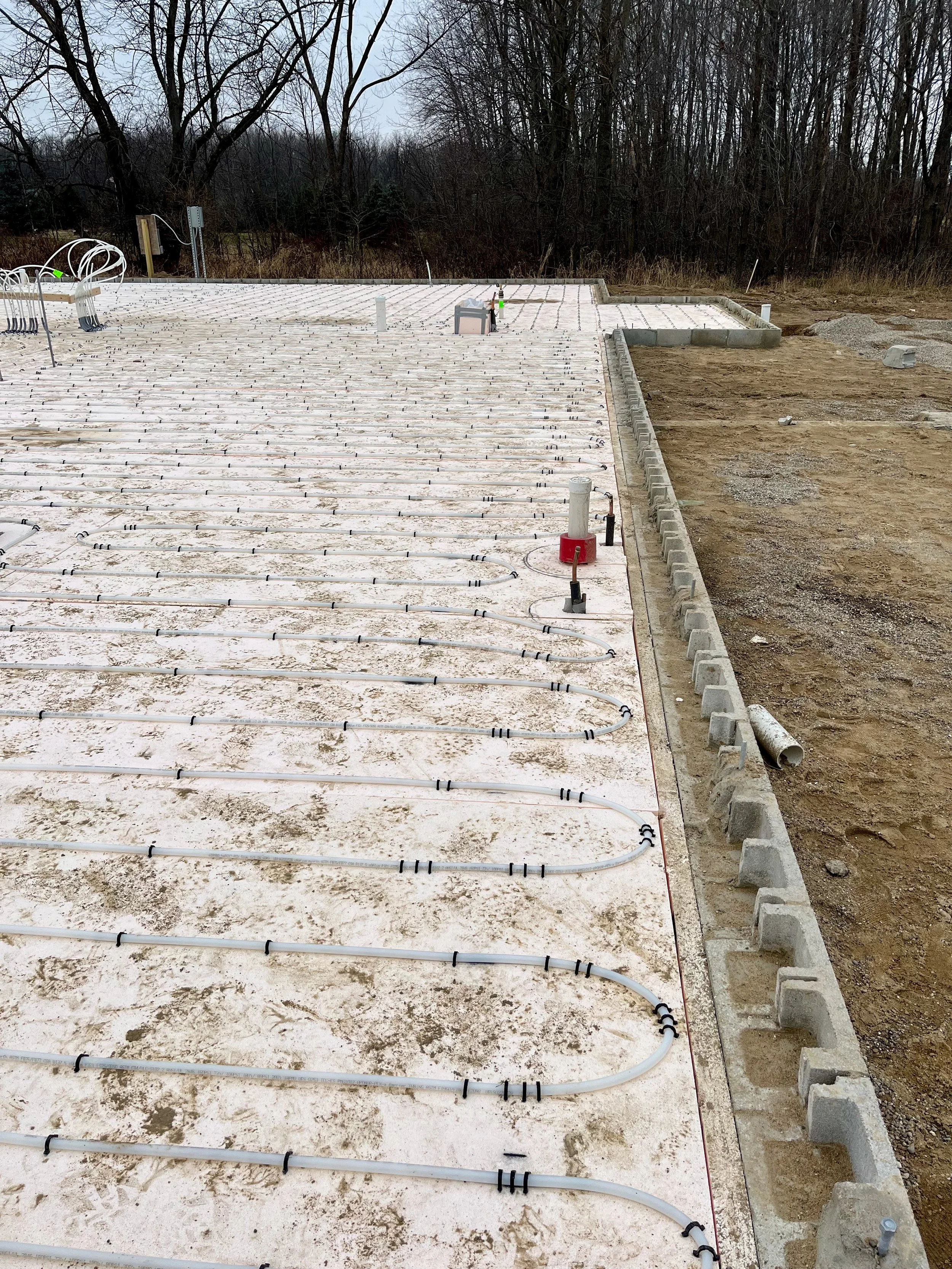 Close up of piping that will be in concrete slab to heat it during cold months.