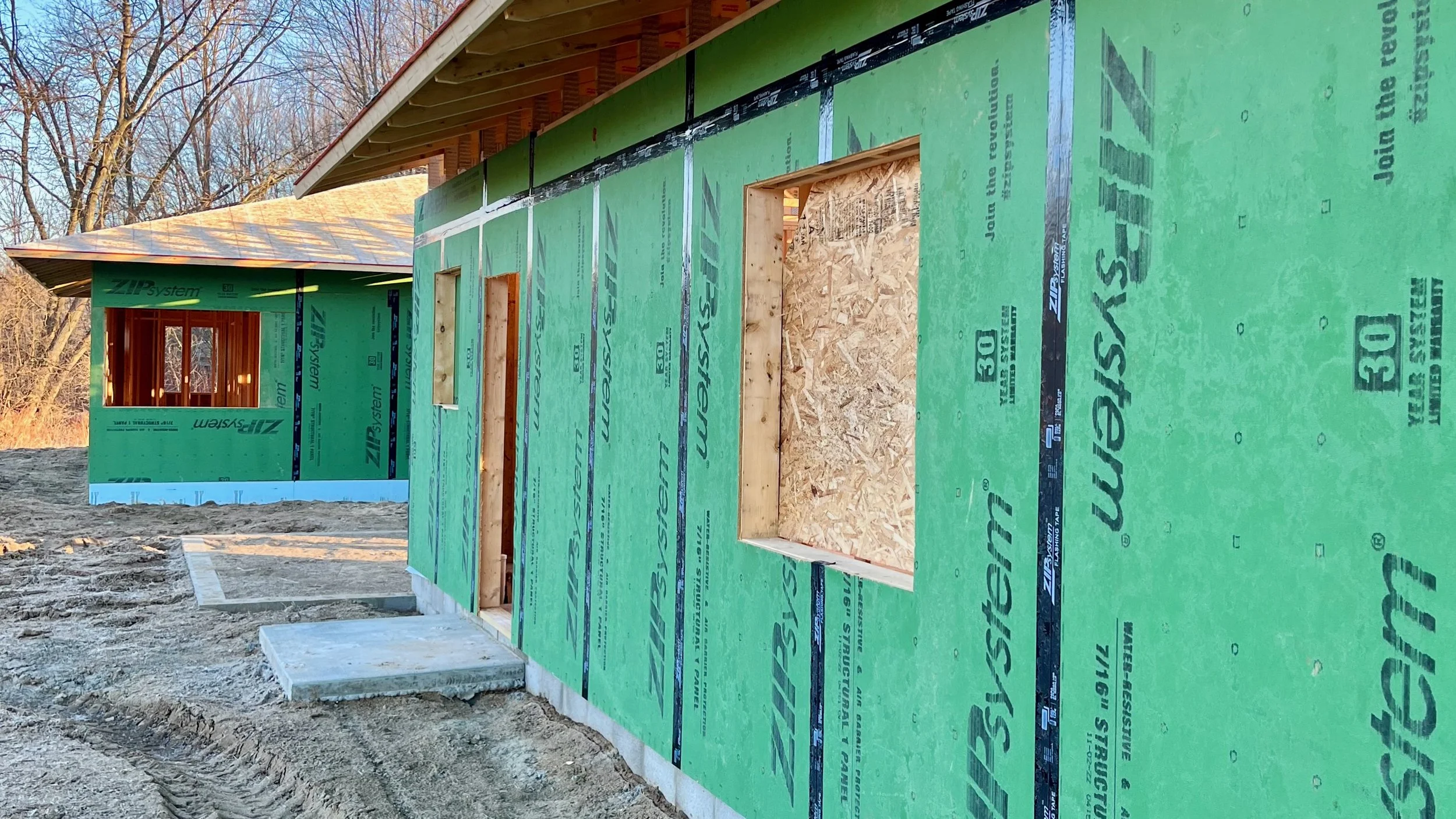 Exterior close up of ZIP system wall sheathing and roof eaves.
