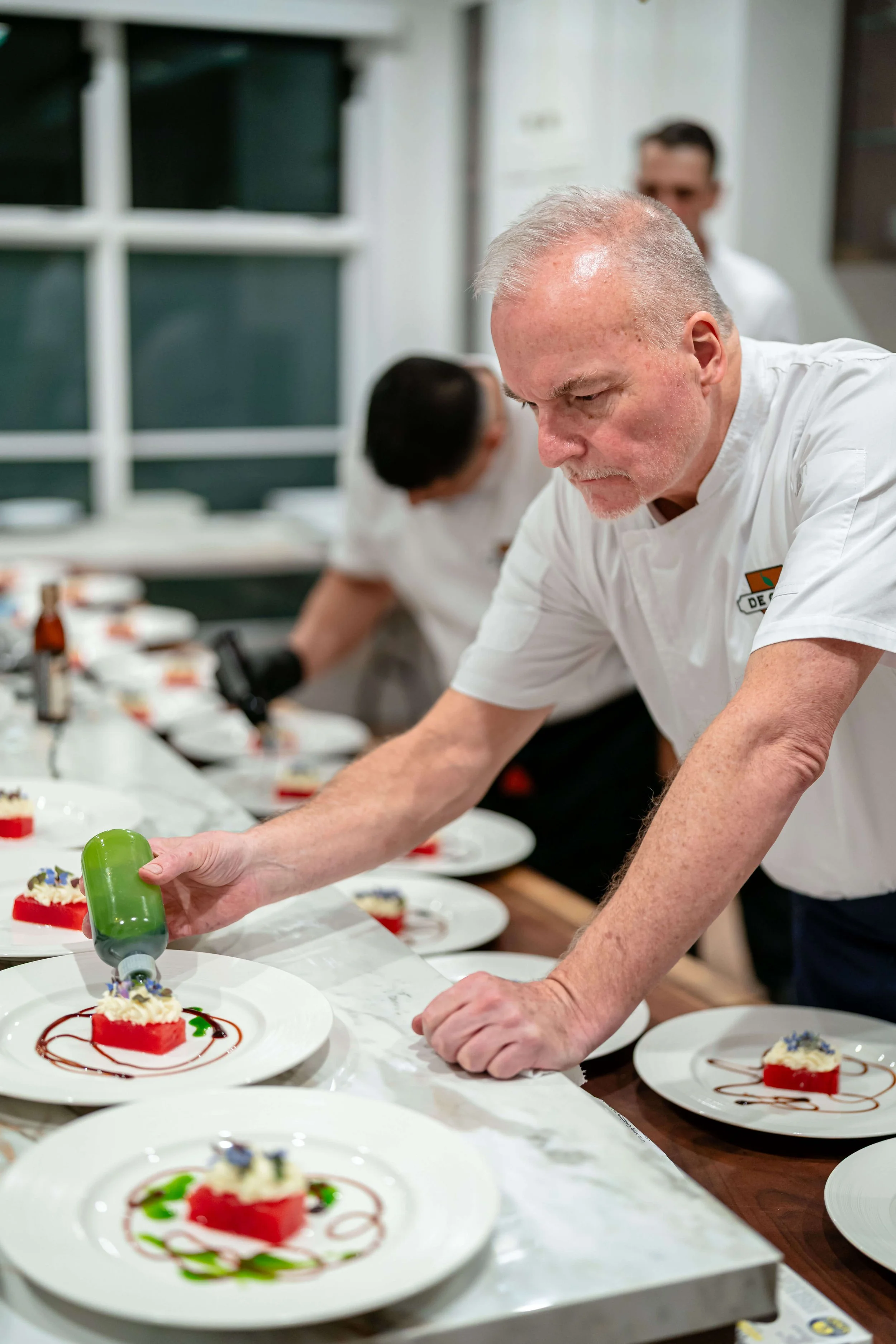 chef david plating dishes for a chicago catering event