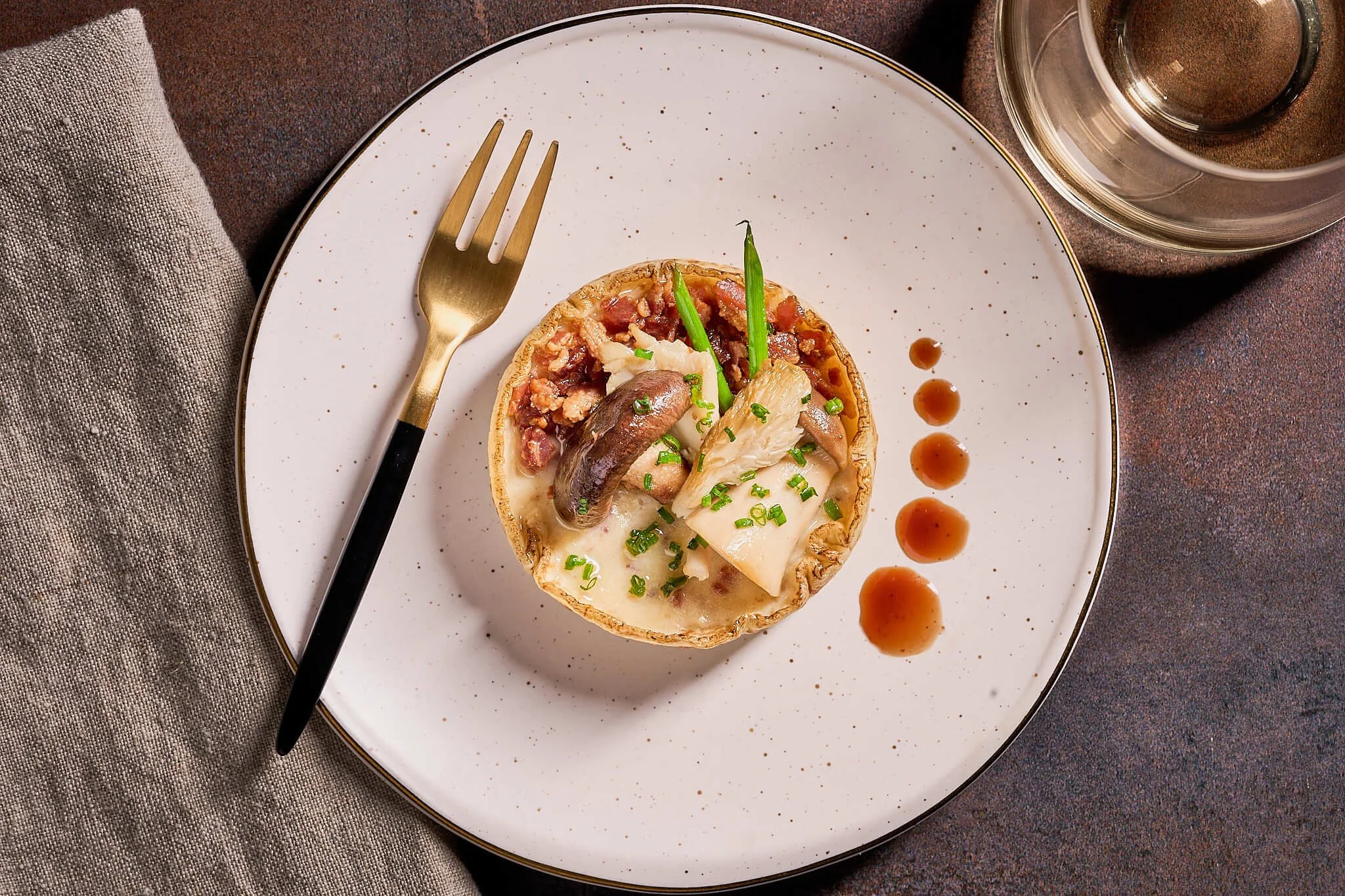 romantic dinner plated topped with mushroom and rich sauce