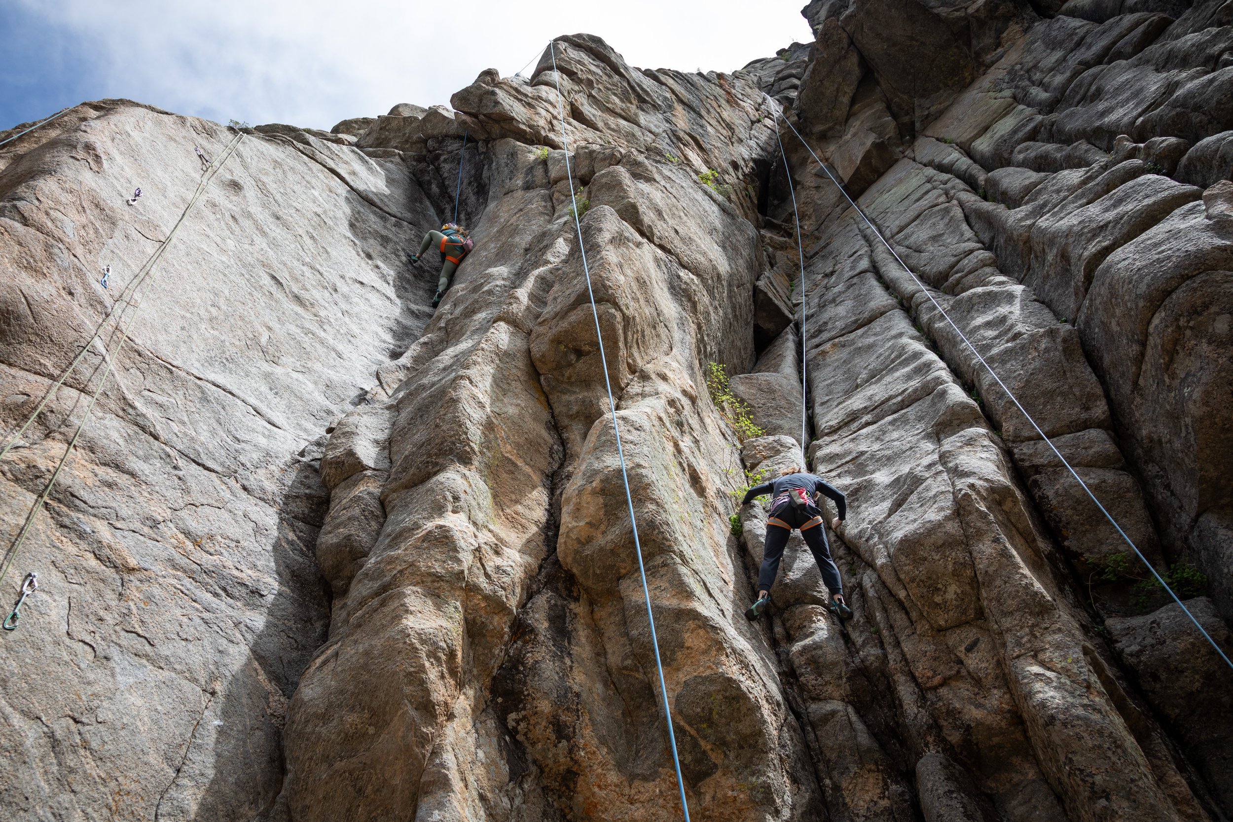 DiGiulian (left) and trailblazing climber, Lynn Hill (right), partake in warmup climbs in Boulder Canyon in Boulder County, CO.