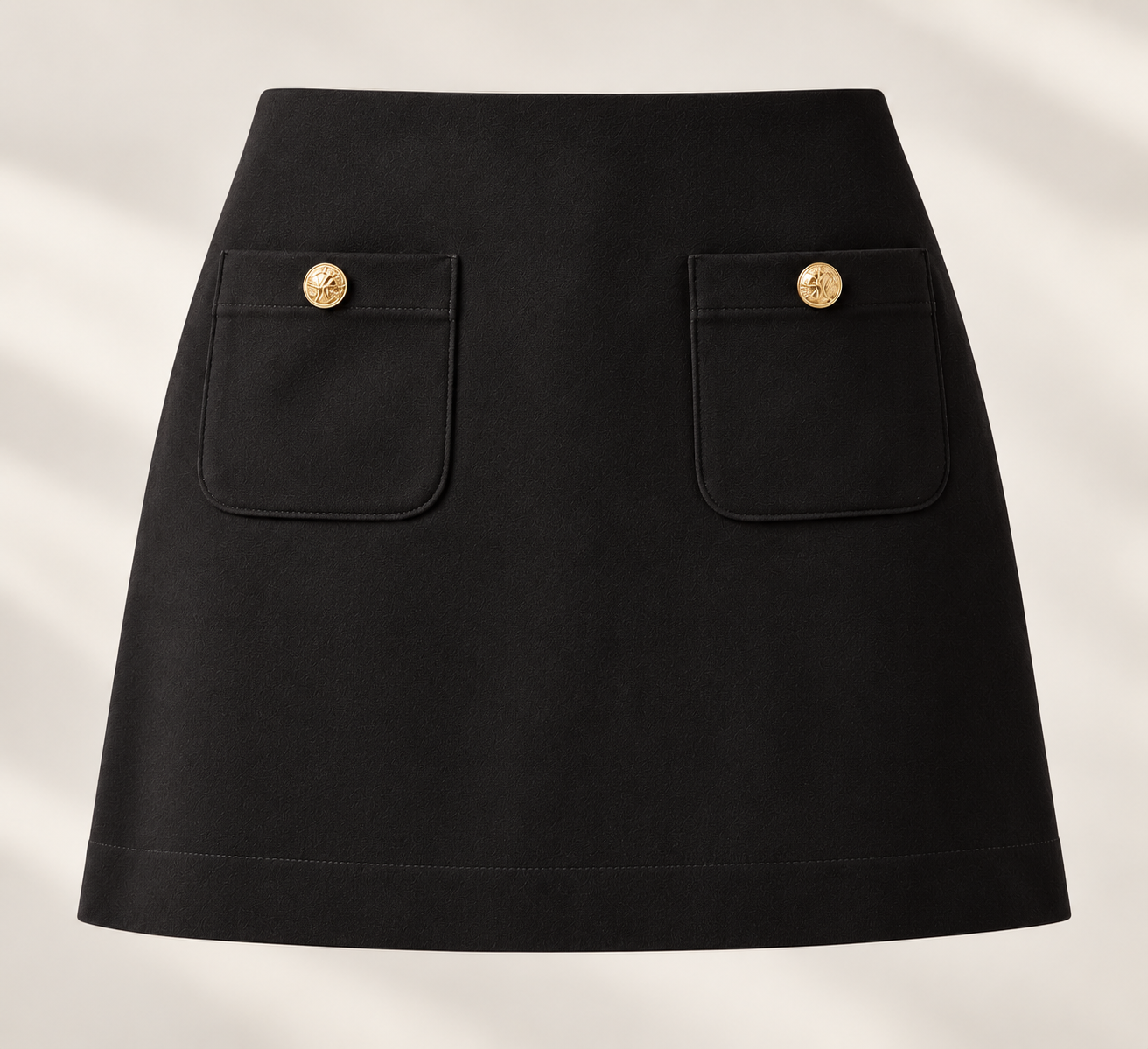 Pop London black mini skirt with gold buttons and pockets.png