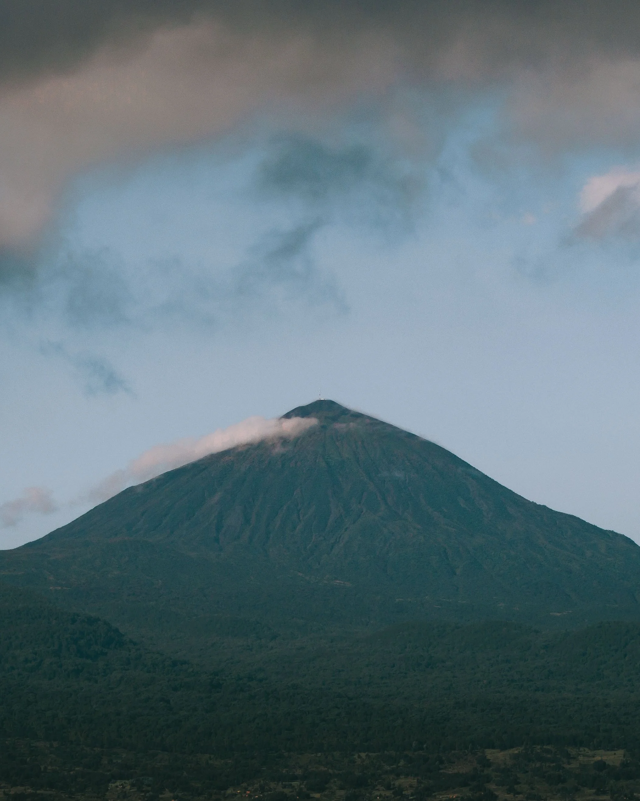 Rwanda is a masterclass in visual storytelling, where every environment offers a completely different study in scale and texture.

The Virunga volcanoes command the horizon, constantly shifting the mood with passing clouds and mist. Down below, the m