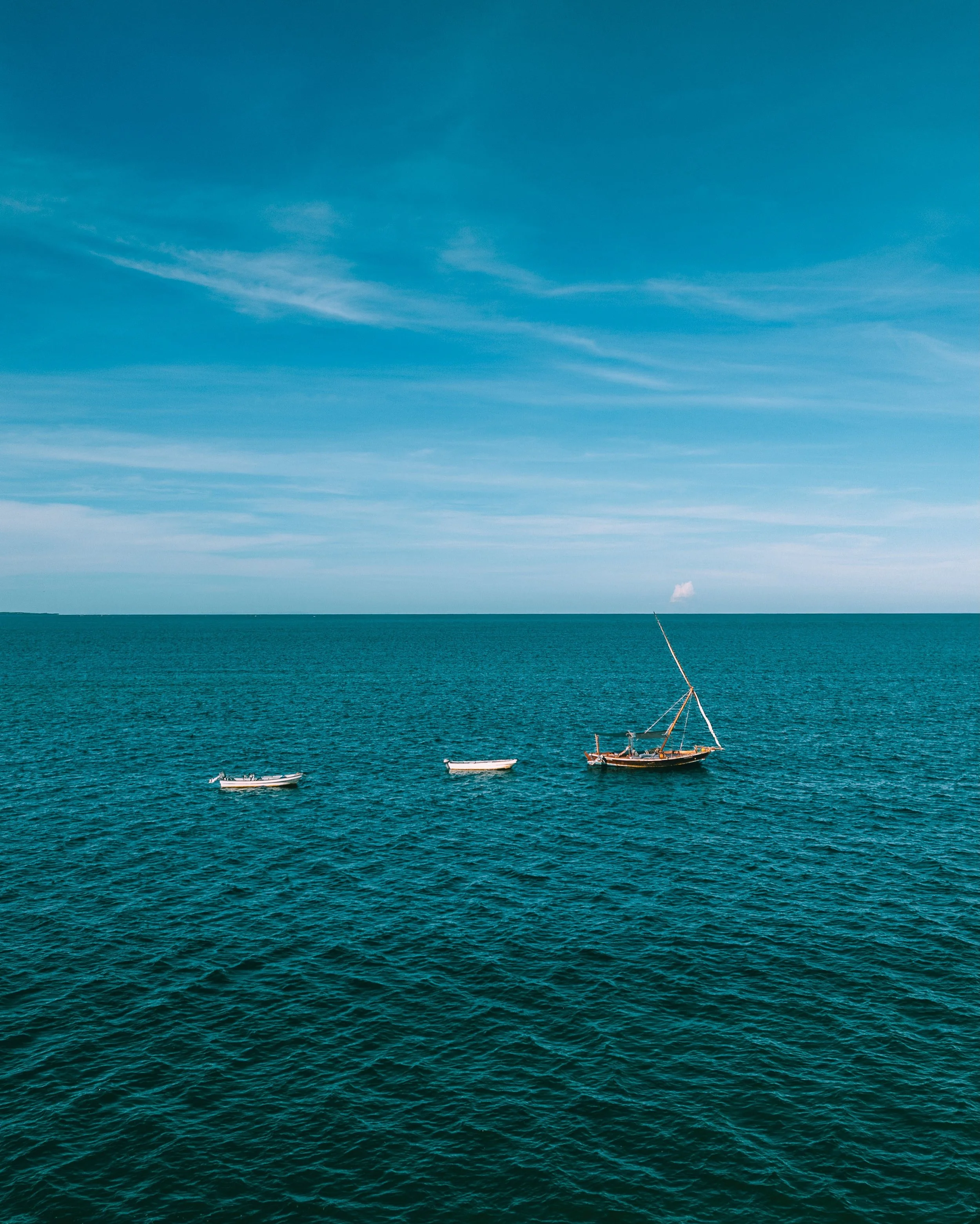 The Art of Less &mdash; Che Shale

Empty ocean holding one small cloud on the horizon. Sawa Sawa anchored in deep teal with two skiffs keeping their distance. A half moon, cratered and rose-toned, alone in a near-black sky. Che Shale gives you nothin
