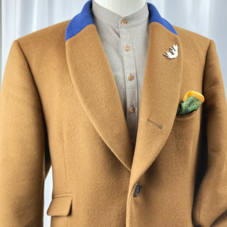Impecable custom shawl-collar overcoat in a fetching tan/camel wool, with deep blue accent. We make a wide variety of custom overcoats.