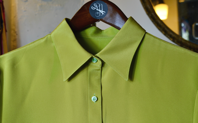 One of our custom shirts in a luxe pink silk with white piping and western style details. Note the personalized monogram inside the collar, which reads "dust bunny"