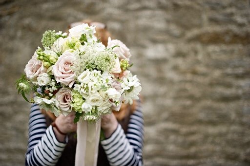 Me behind a bridal bouquet