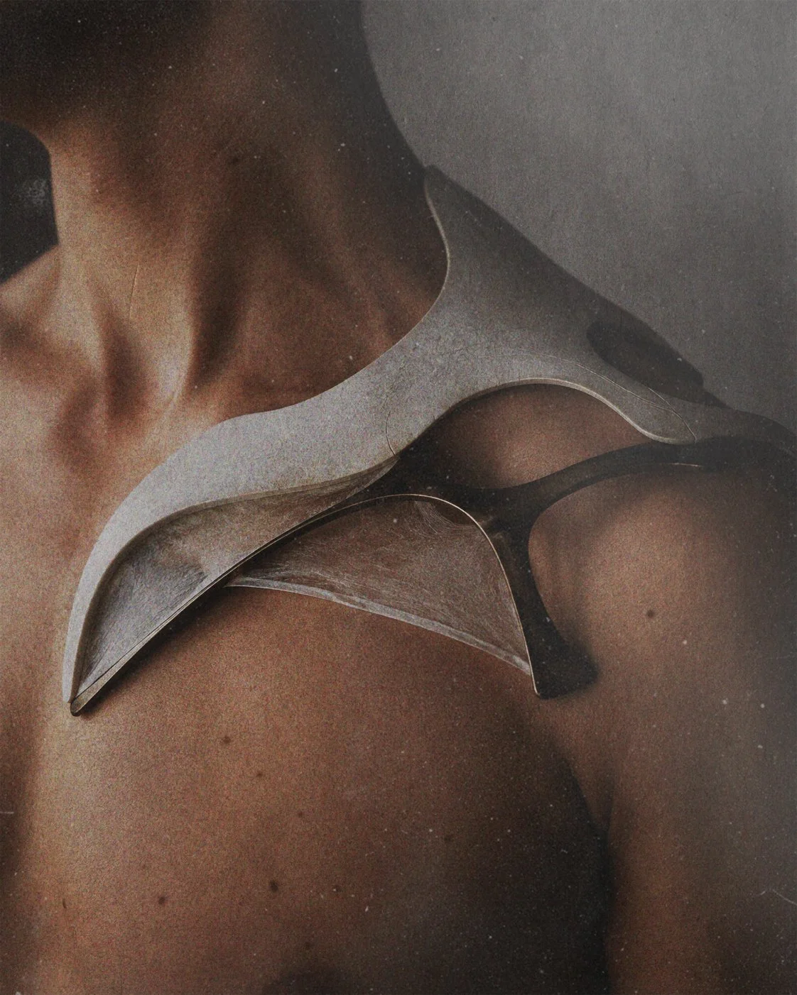 Hybrid sculptural fragment following the shoulder and clavicle through layered mineral and metallic surfaces.
