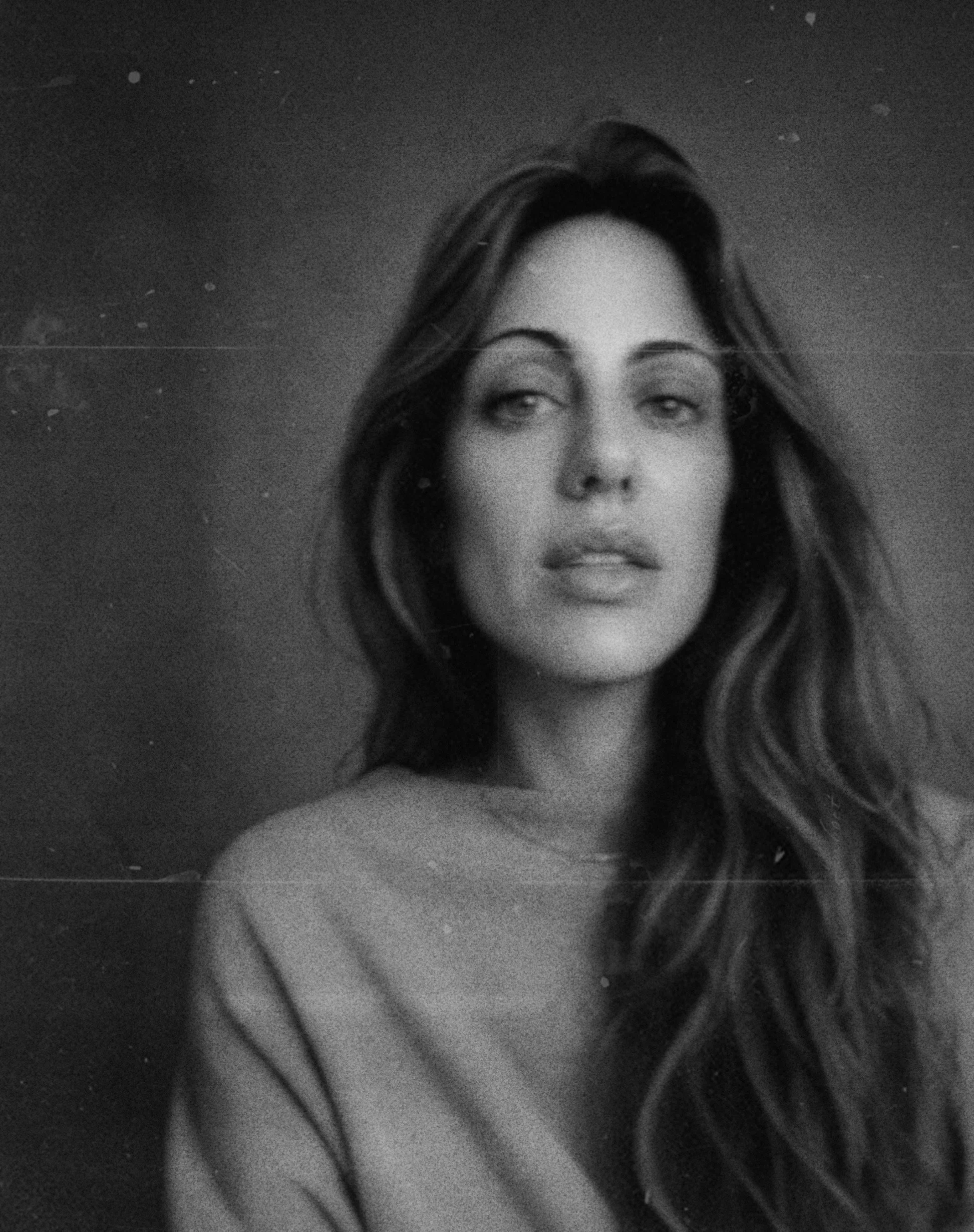 Lucía Silva, founder of LS•STUDIO, photographed beside a mineral surface in León, Spain.