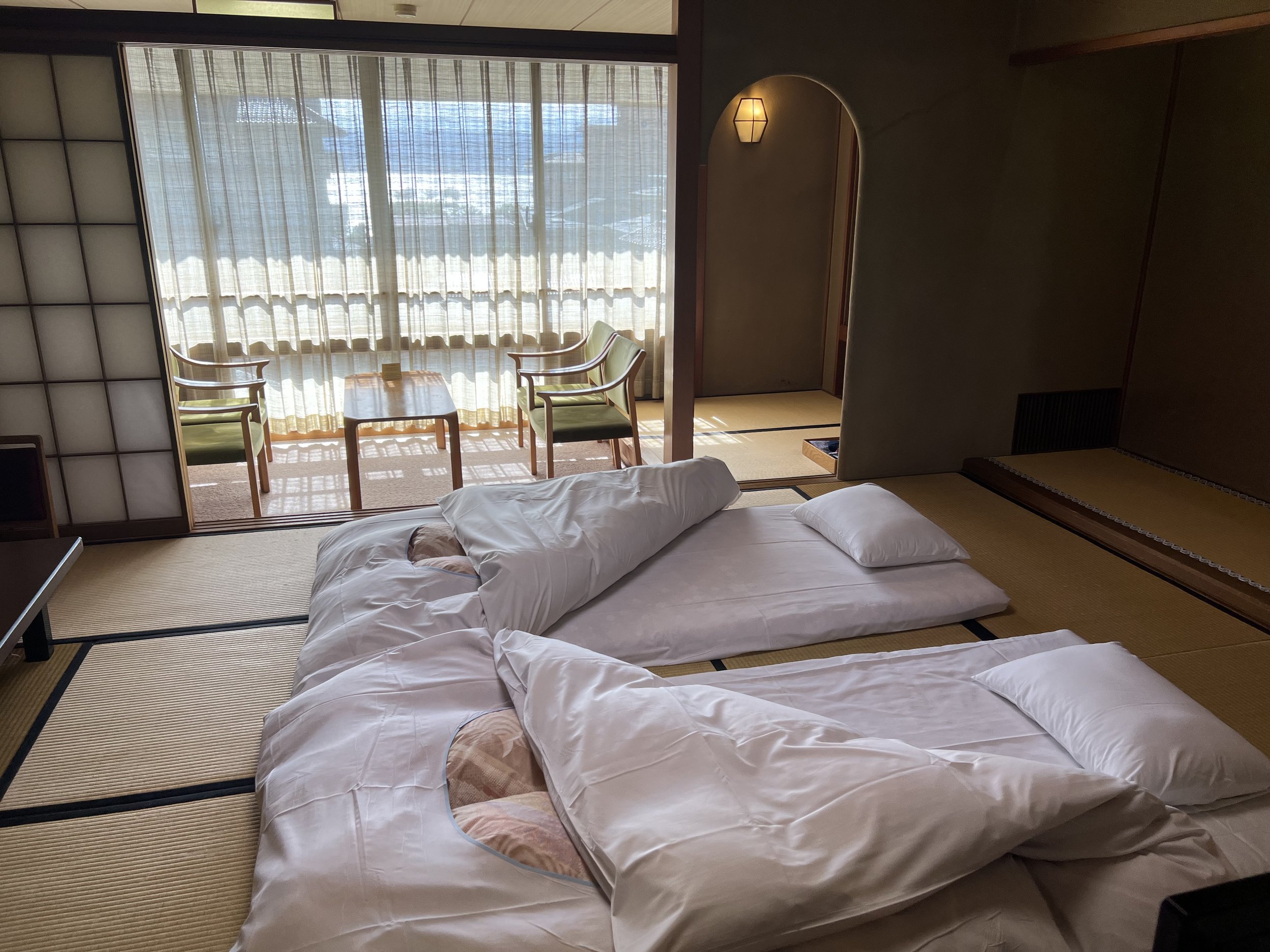 Beautiful Japanese room with futons in Hama no Yu in Suwa
