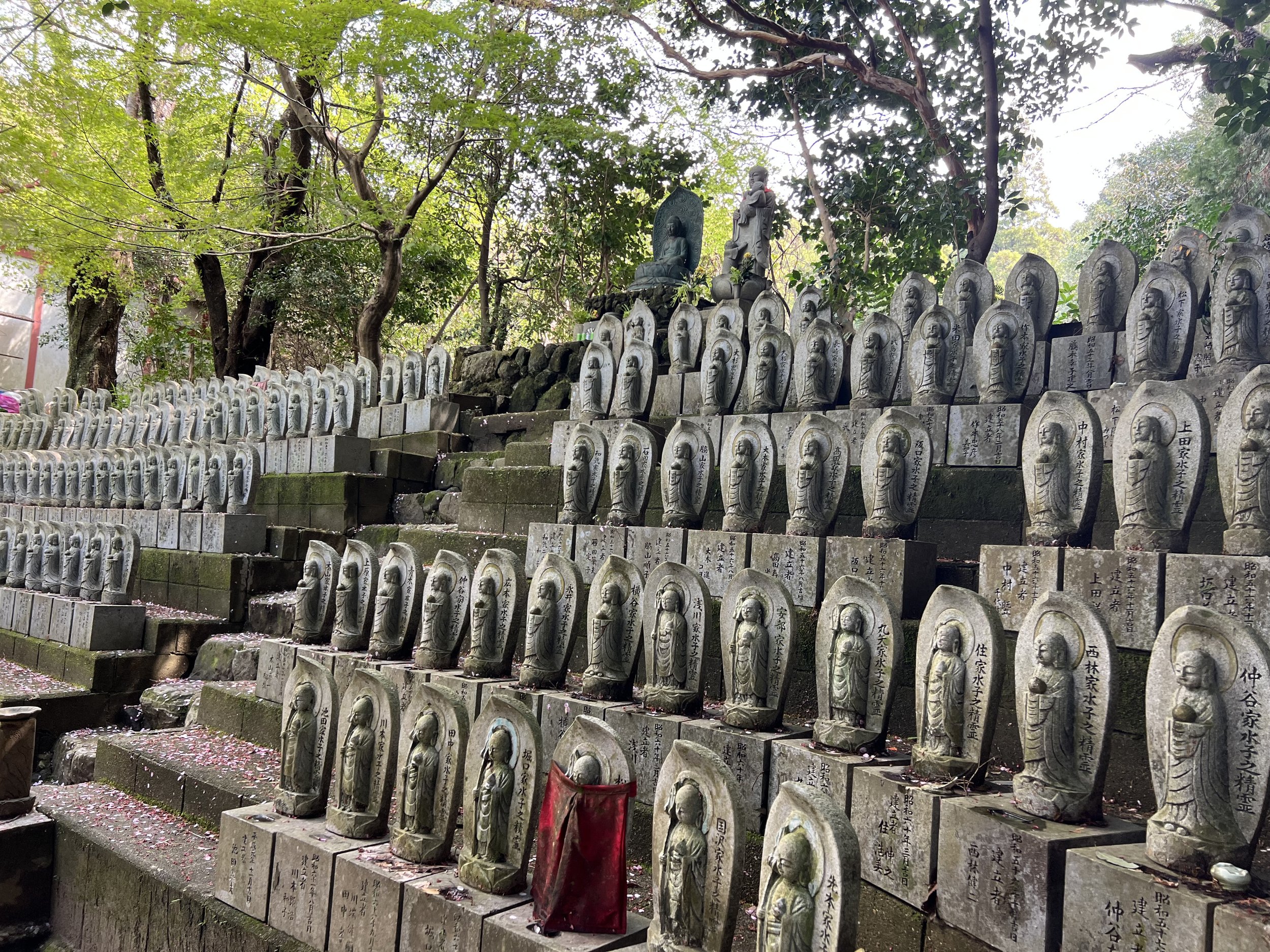 Many statues at a small shrine near Omiwa shrine