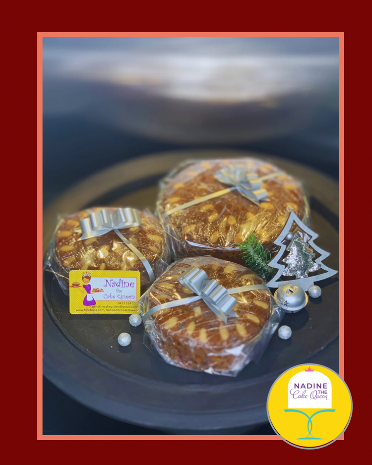 Wrapped Christmas fruit cakes tied with silver bows