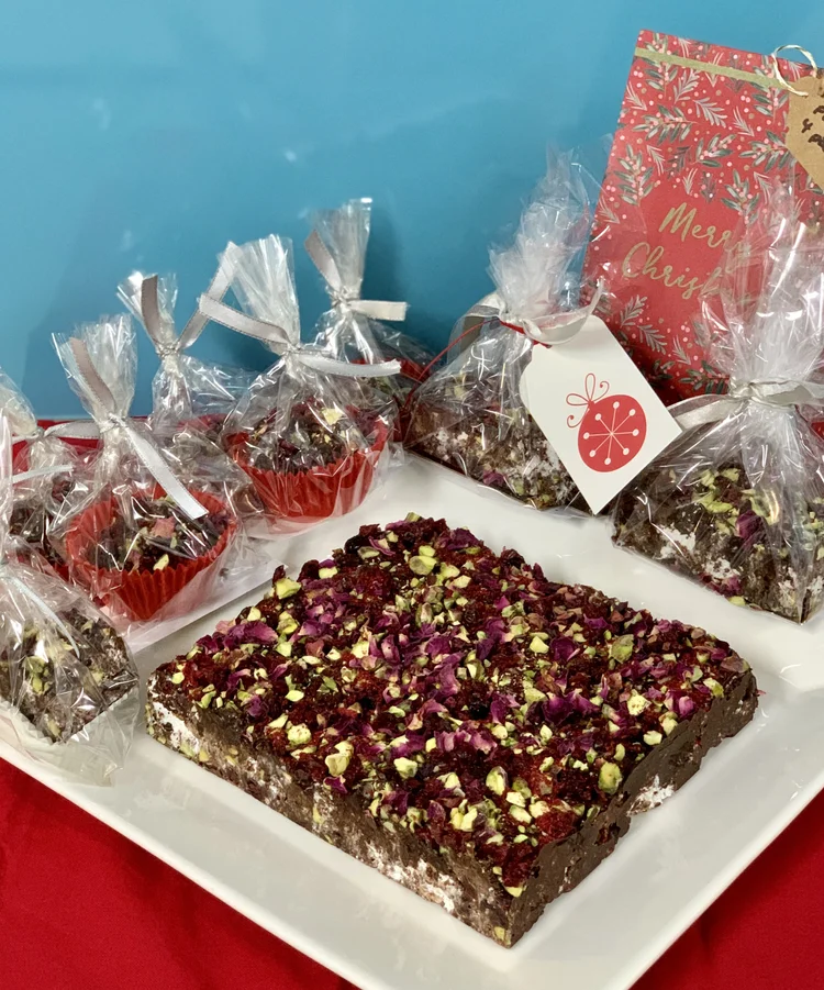 Rocky road topped with rose petals and pistachios