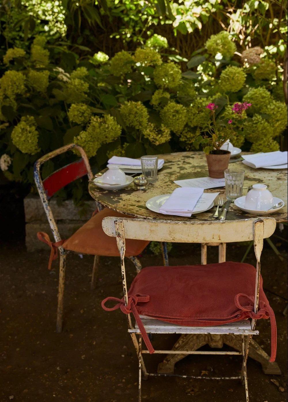 rustic outdoor table set for tea at Petersham Nurseries in the summer