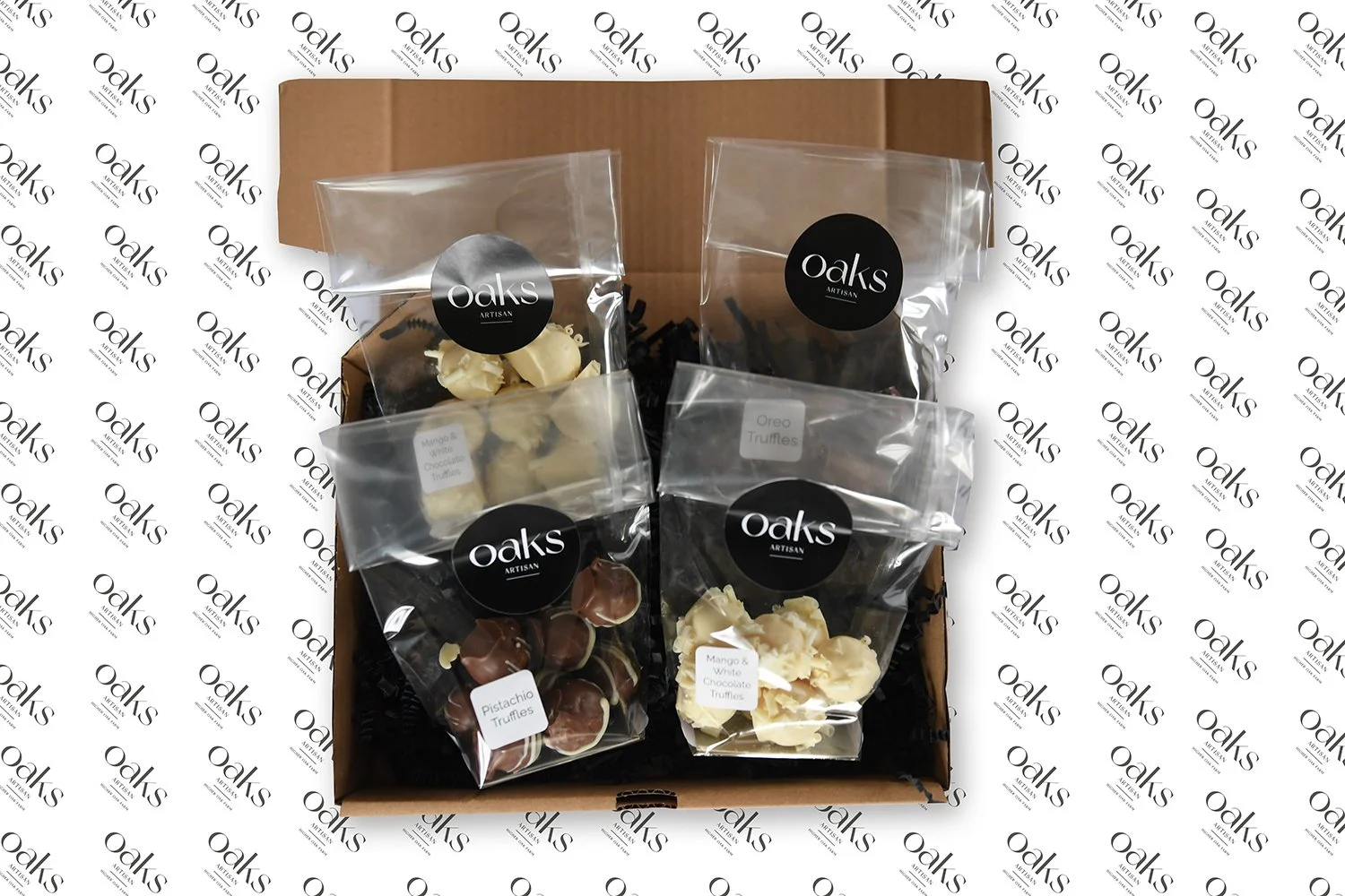 Handmade Chocolate Truffle Selection Box: A personalised box of 4 artisanal truffle flavours, including Milk Chocolate Raspberry, White Chocolate Pistachio, and more. perfect for gifting.