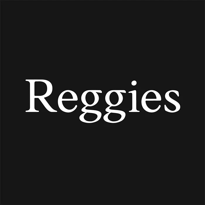 Black background with white text that reads "Reggies"