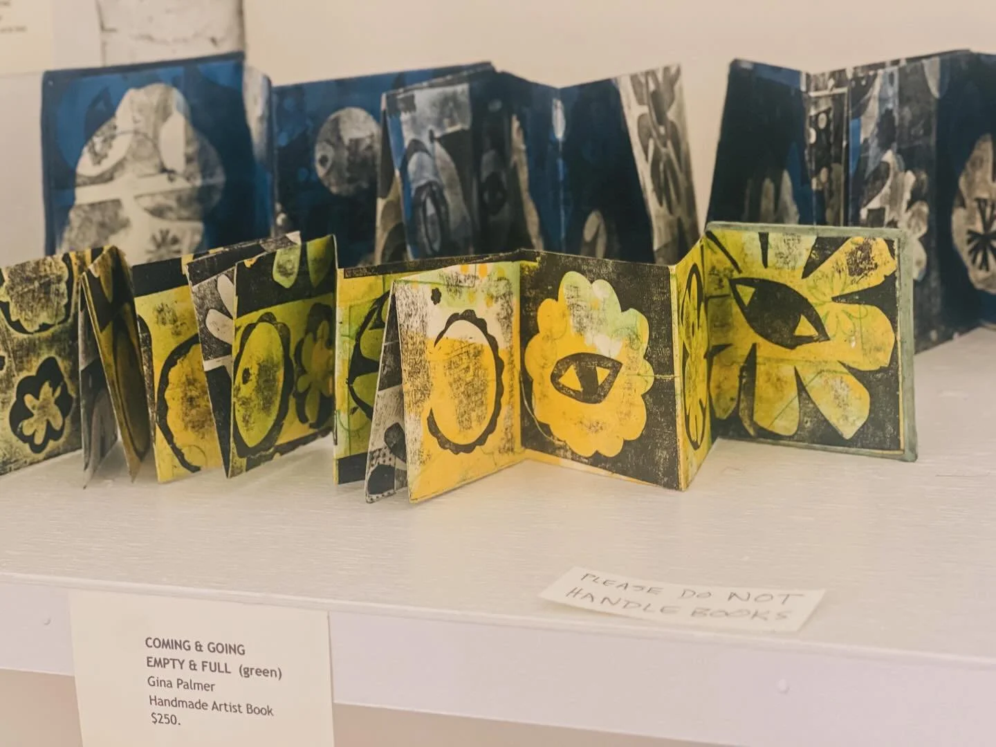 Art you can hold (carefully!). ✨ Featuring Gina Palmer&rsquo;s stunning handmade artist books. These leporello-style pieces bring printmaking into the third dimension, blending deep blues and acidic greens into a narrative of form and space.#On displ