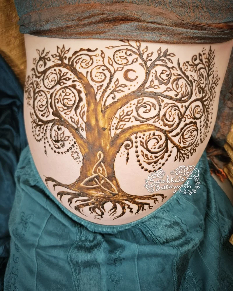 #NordicMythology #VikingSymbolism #HennaArt #PregnancyHenna #MotherhoodMagic #TreeOfLife #SacredSymbols #MaternalLove  #HennaStorytelling #bellyhenna #coloradohenna #pregnancyart