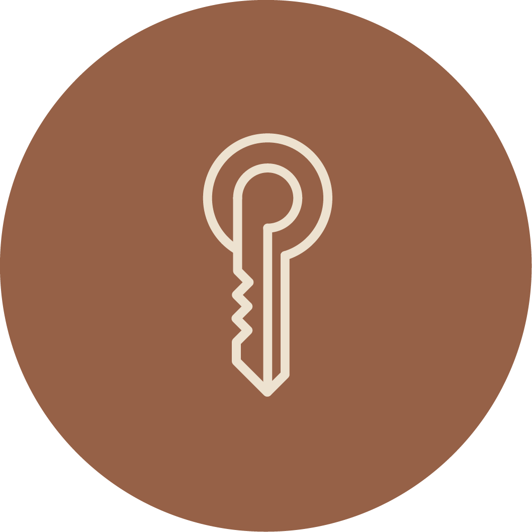 Icon of a key on a brown circular background.