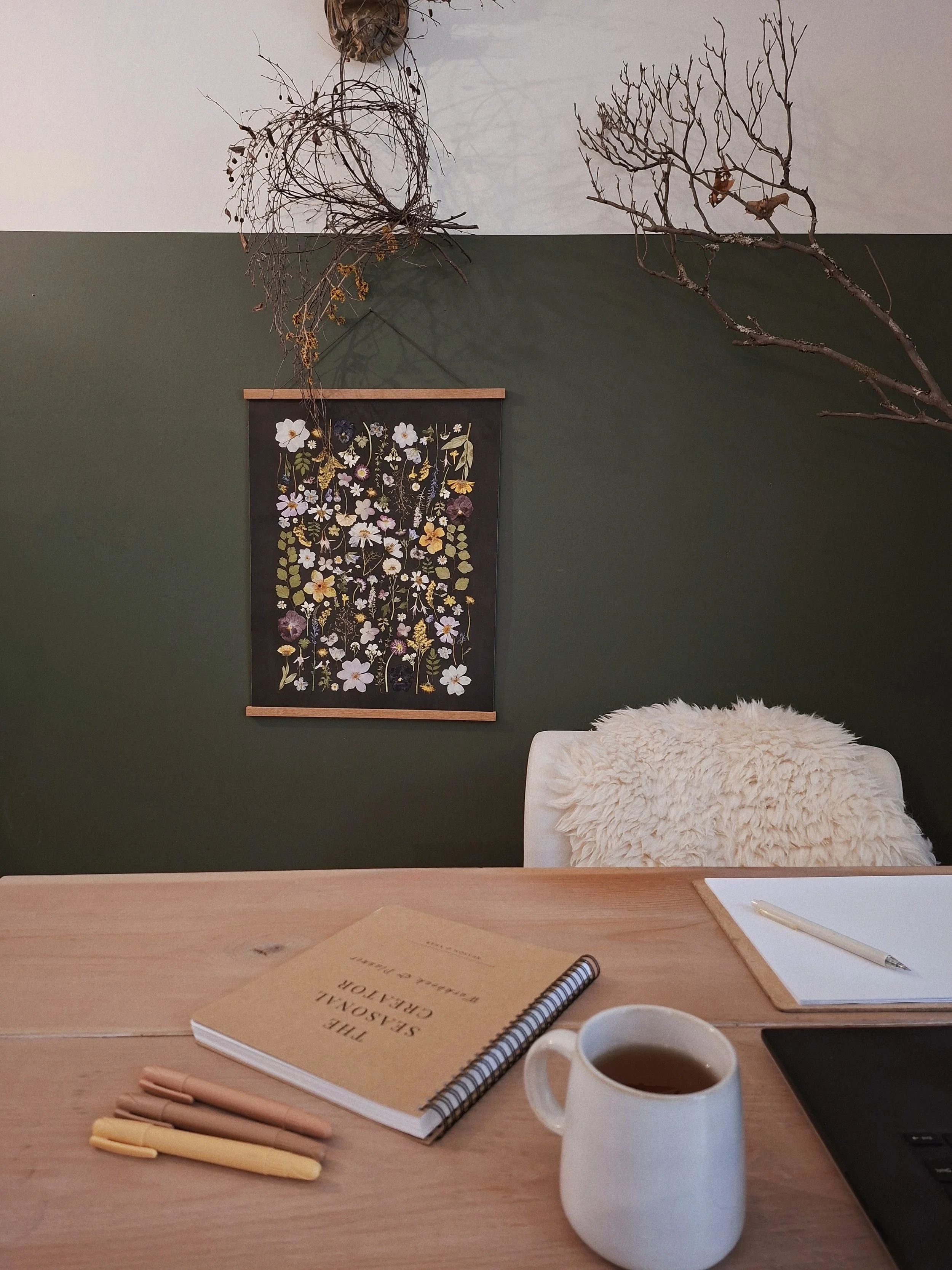 The Seasonal Creator Workbook & Planner with coloured pencils and a mug, set up for an individual creative practice session