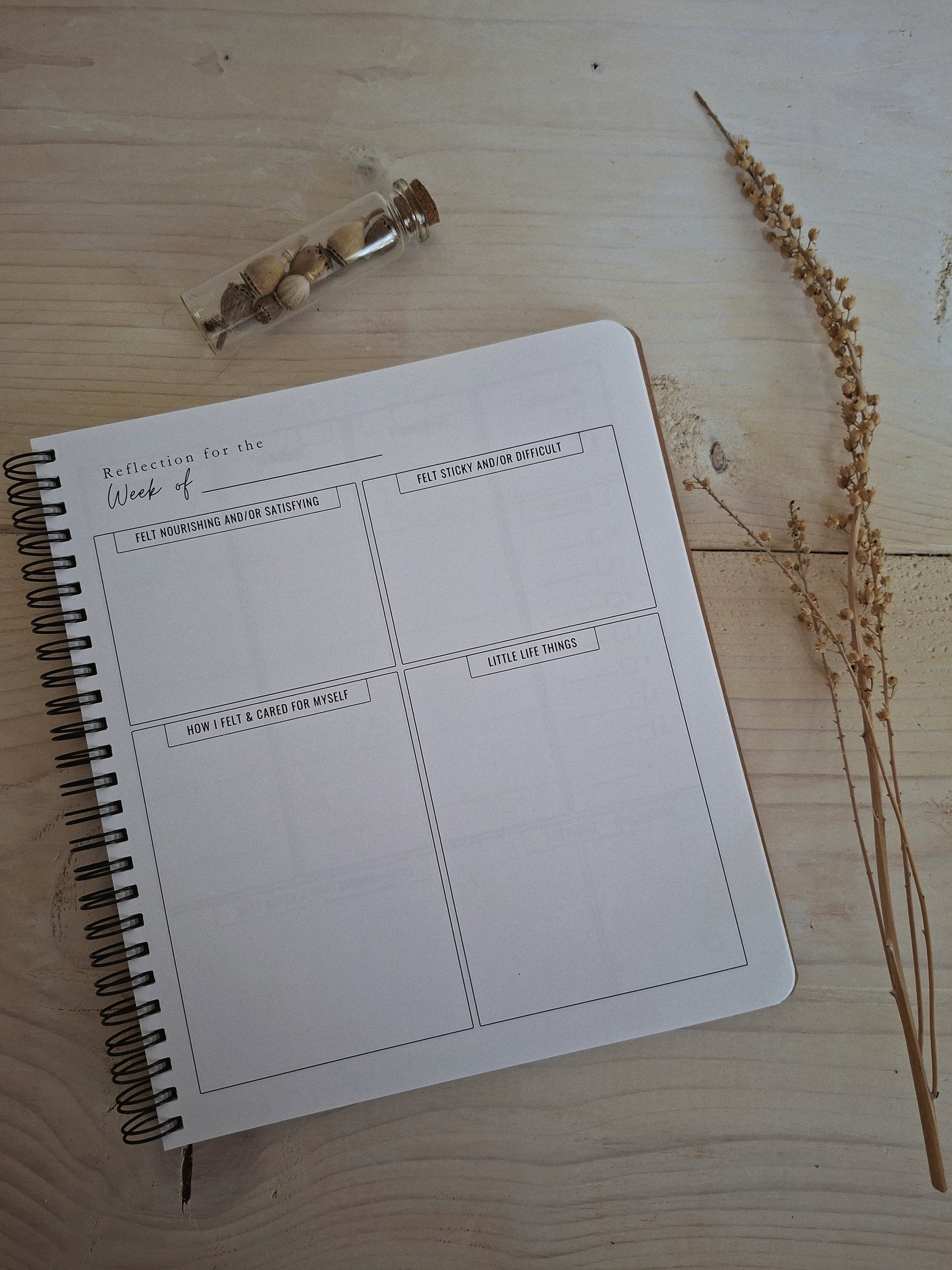 The Seasonal Creator Workbook & Planner open to a monthly planning spread.