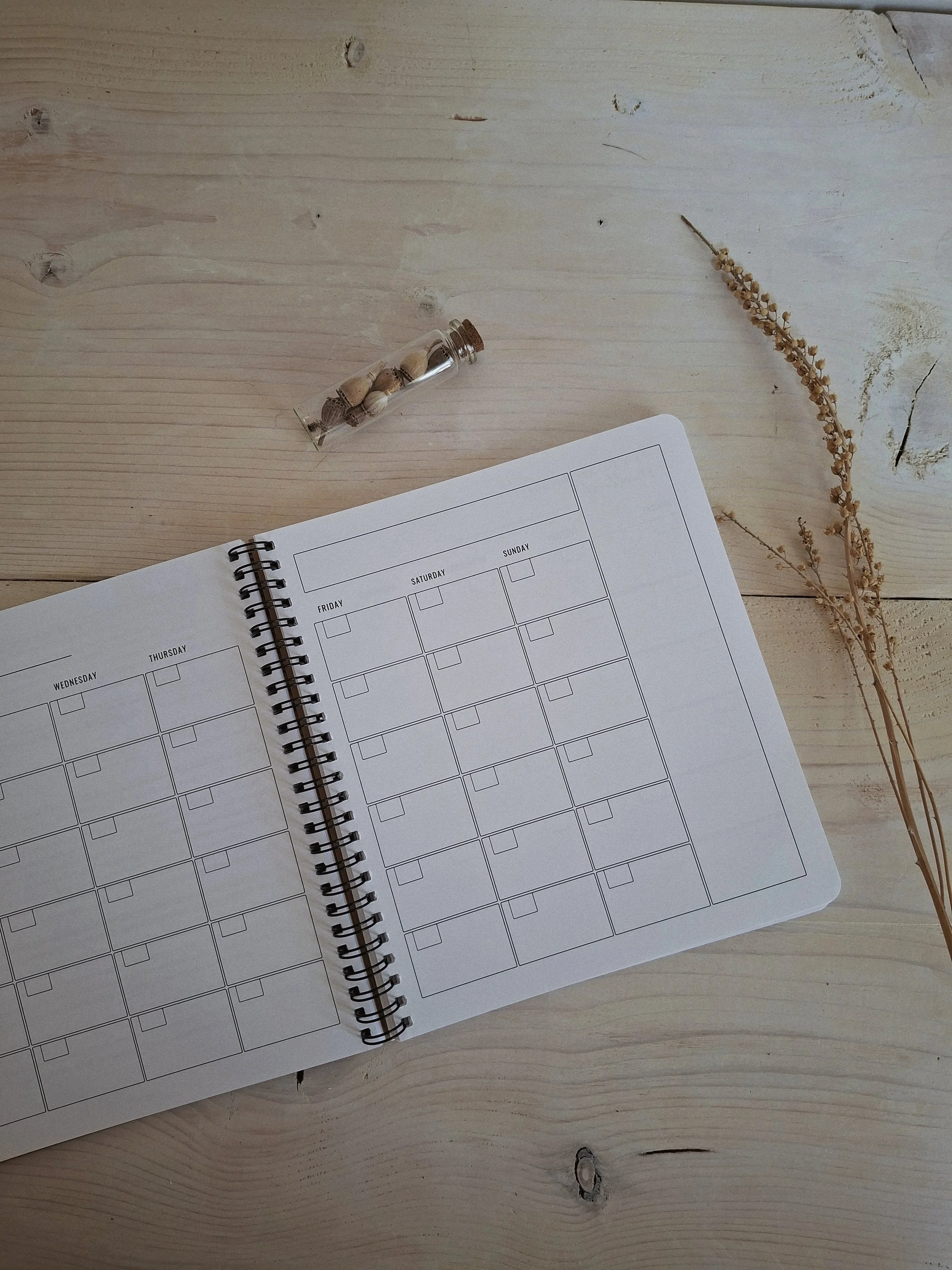 The Seasonal Creator Workbook & Planner open to a weekly planning spread.