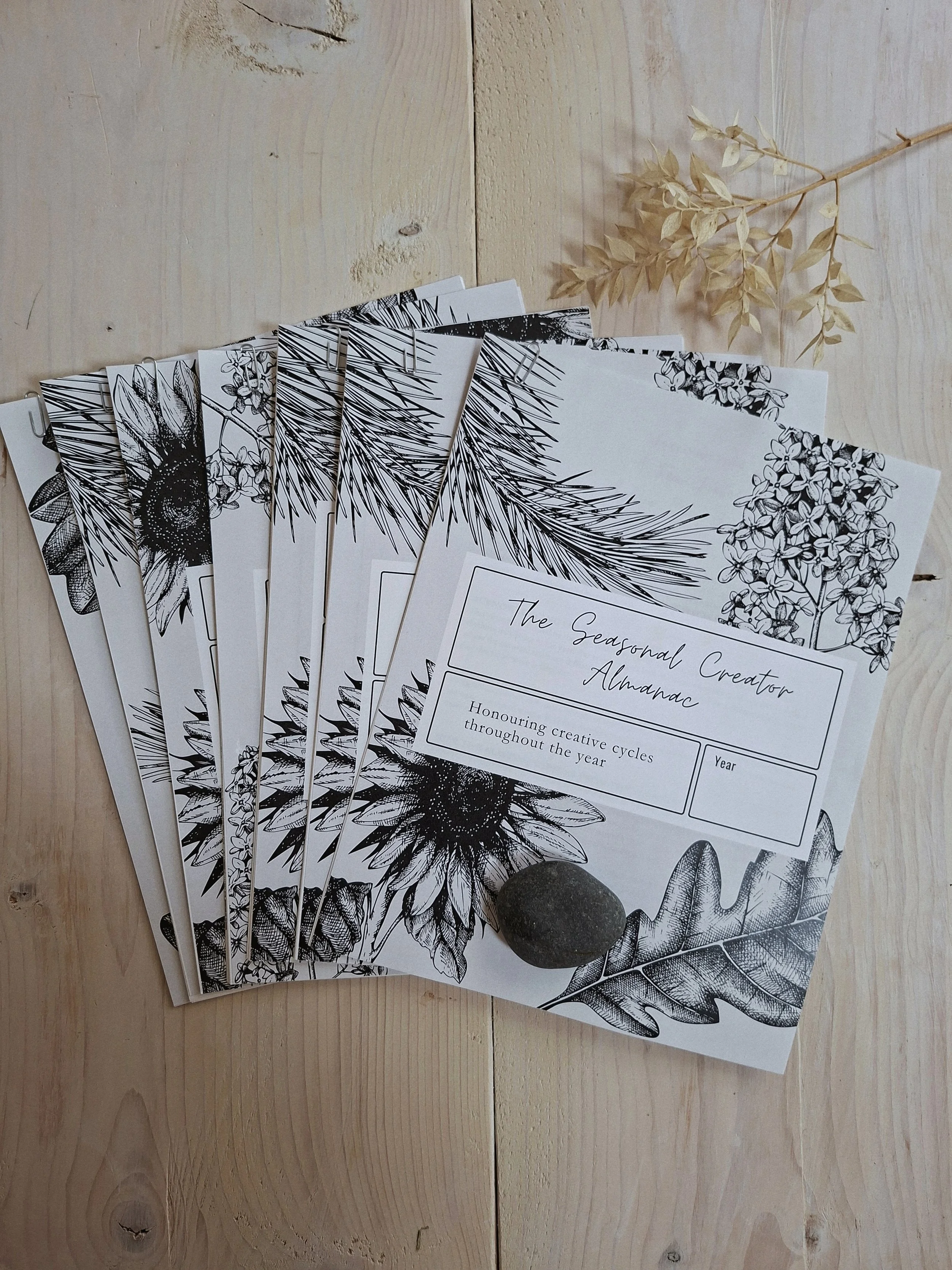 The six workbooks included in The Seasonal Creator Almanac, arranged in a fan.