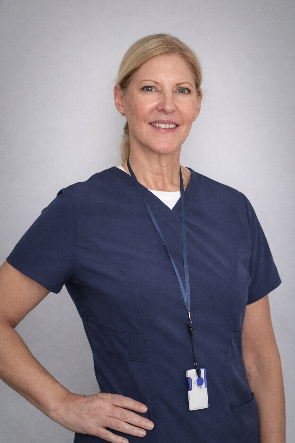 Cindy Spooner, pediatric physical therapist, smiling in a professional healthcare setting
